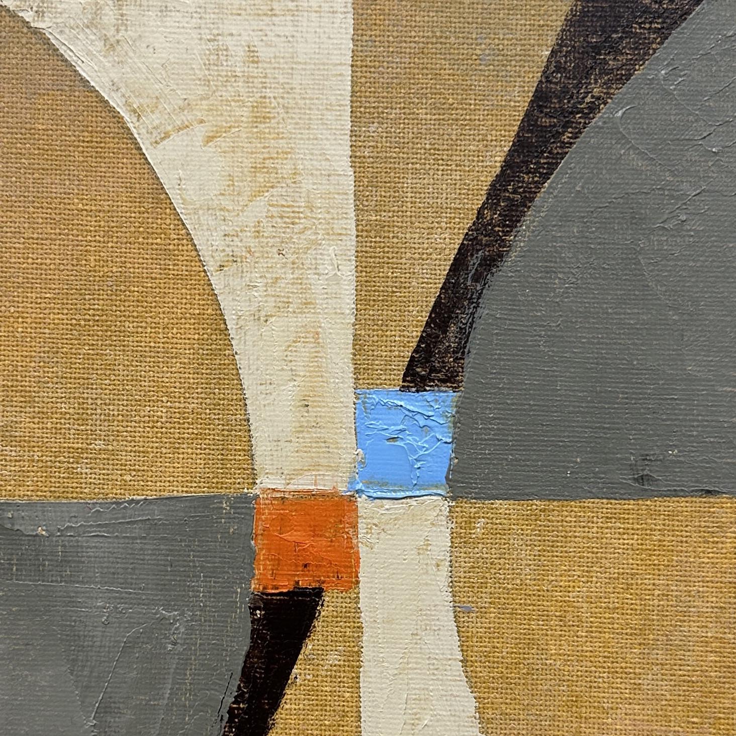 A painting on a white wall with a blue and orange design.