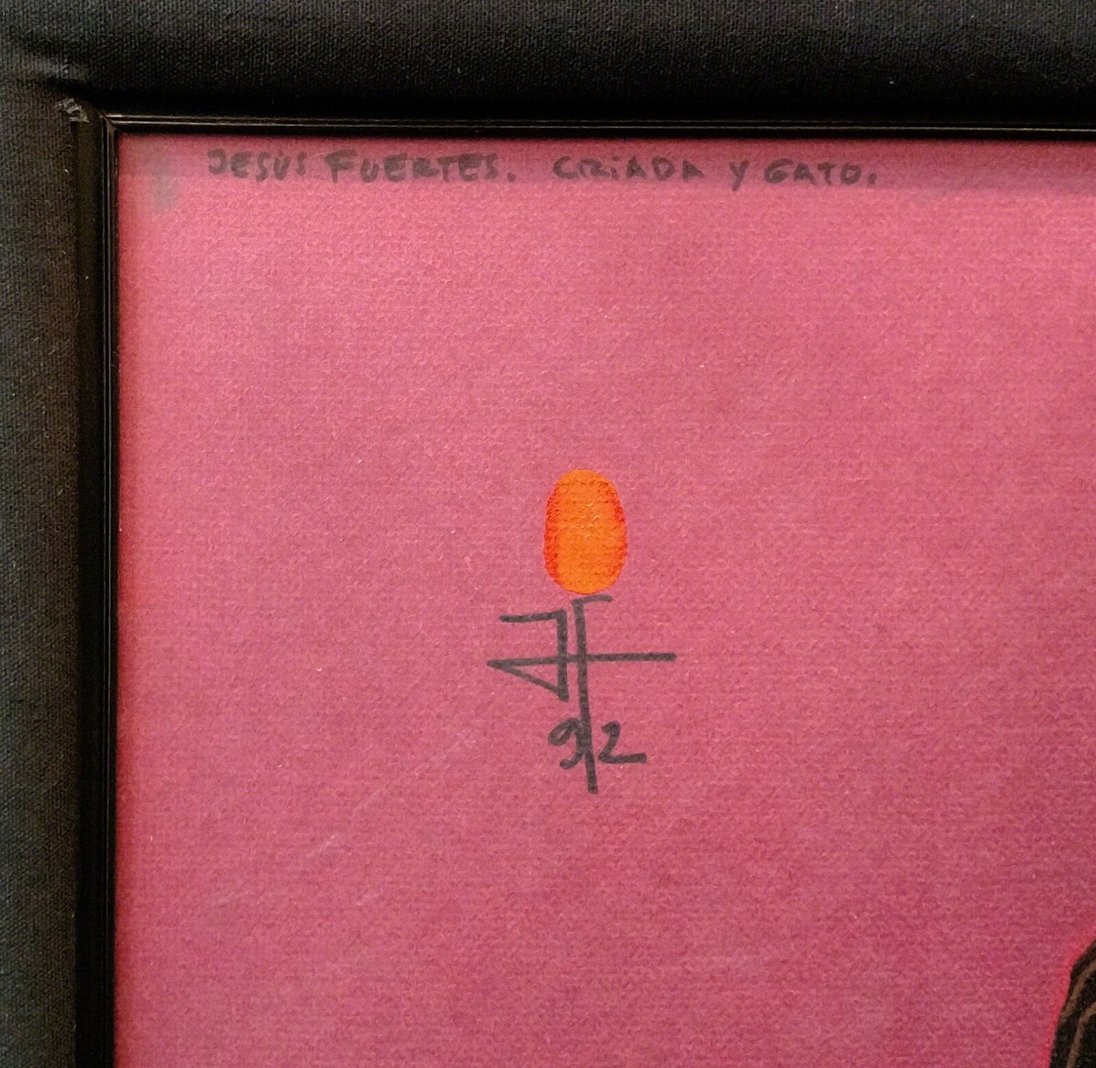 A painting of a woman with a cat in a black frame.