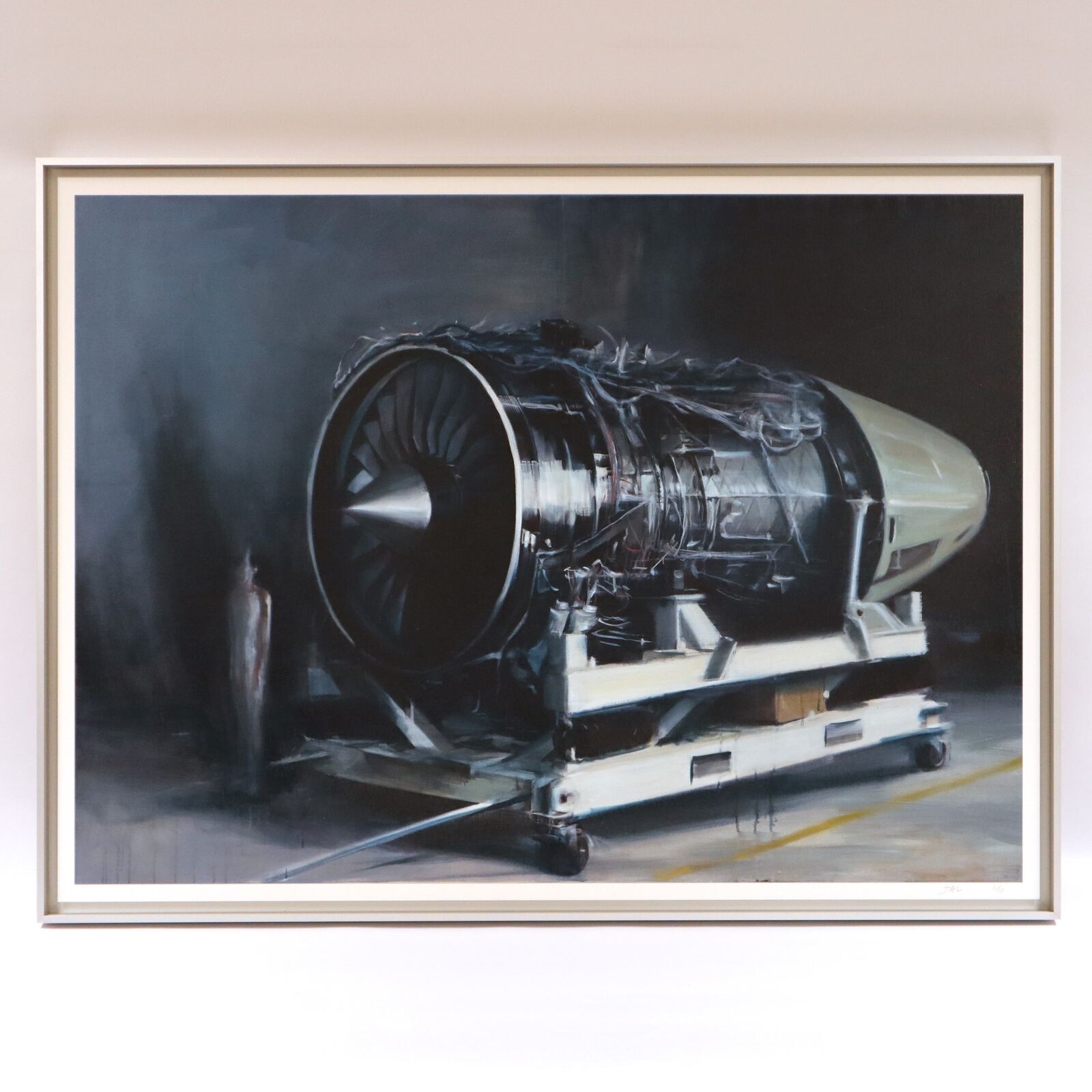 A painting of a jet engine on a cart in a hangar.