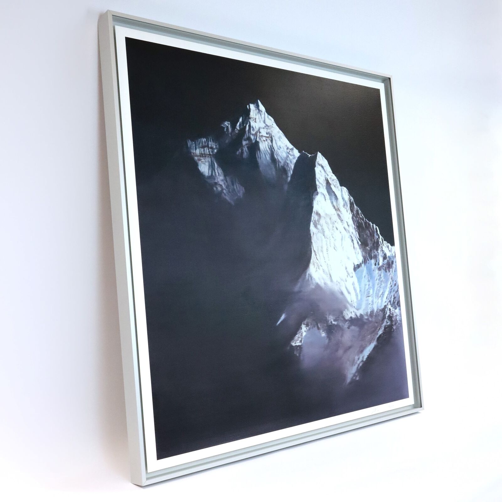 A painting of a snow covered mountain in the dark.