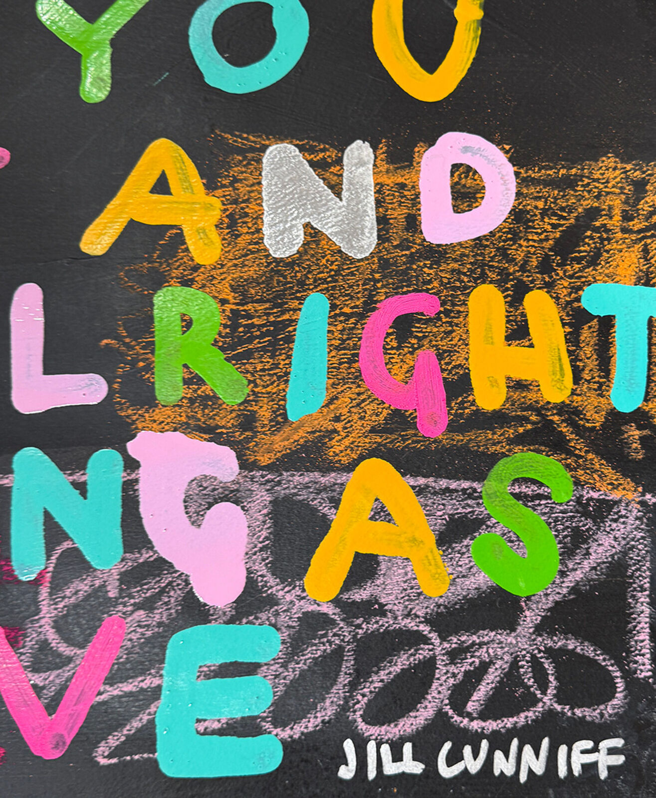 A colorful painting with a quote on it that says enjoy the ride.