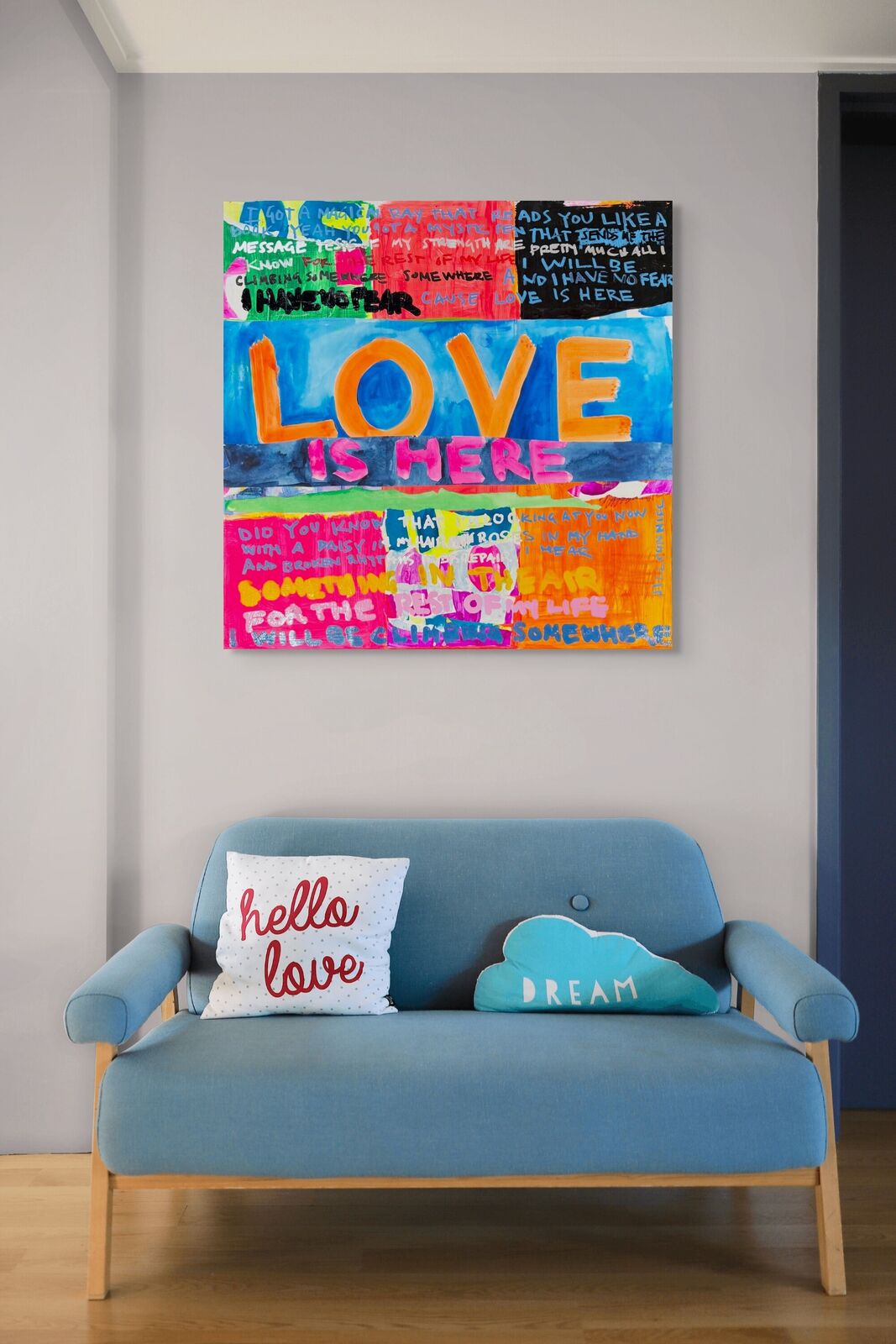 A painting with the words love is here written on it.
