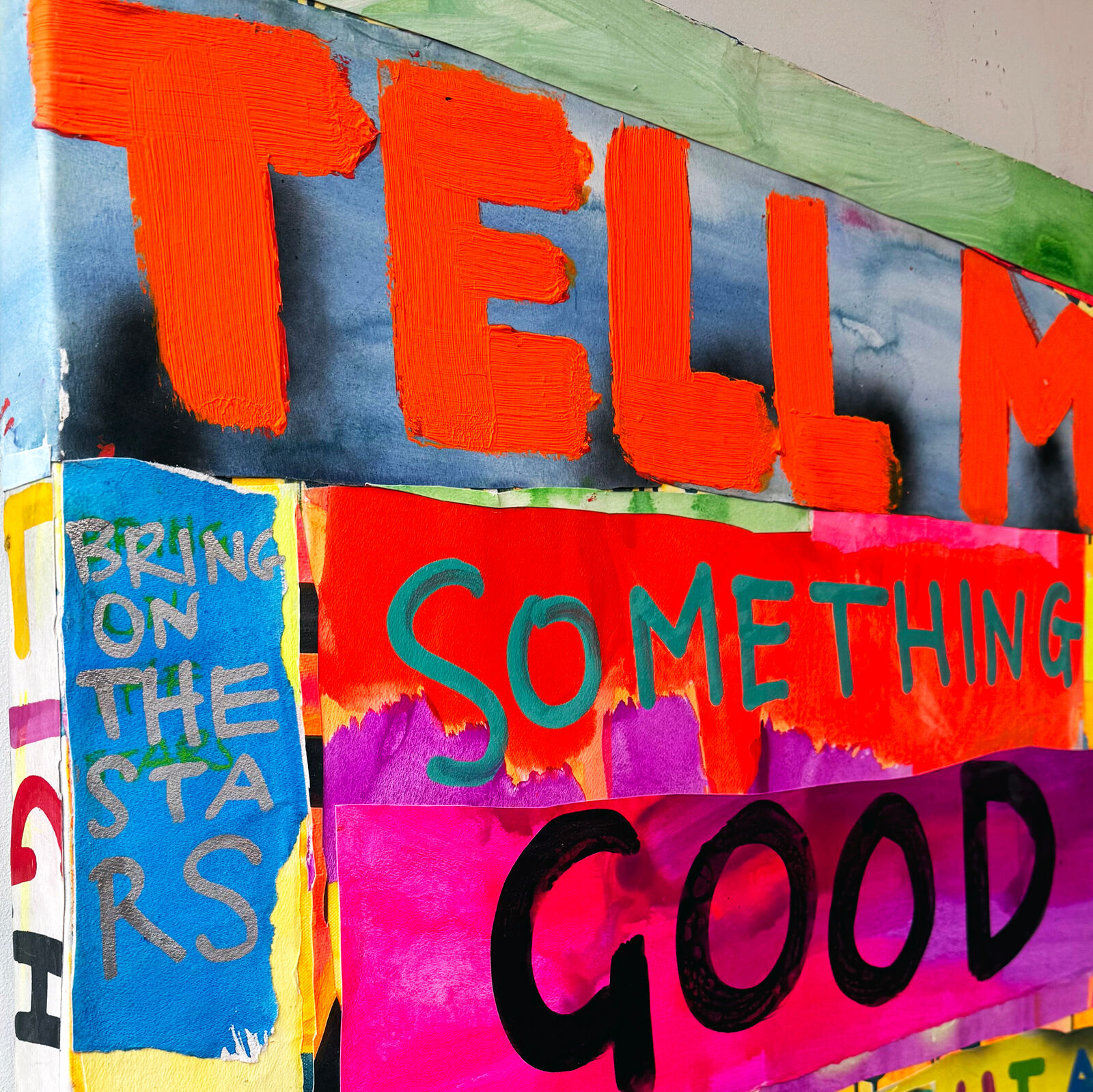 A painting with the words tell me something good on it.