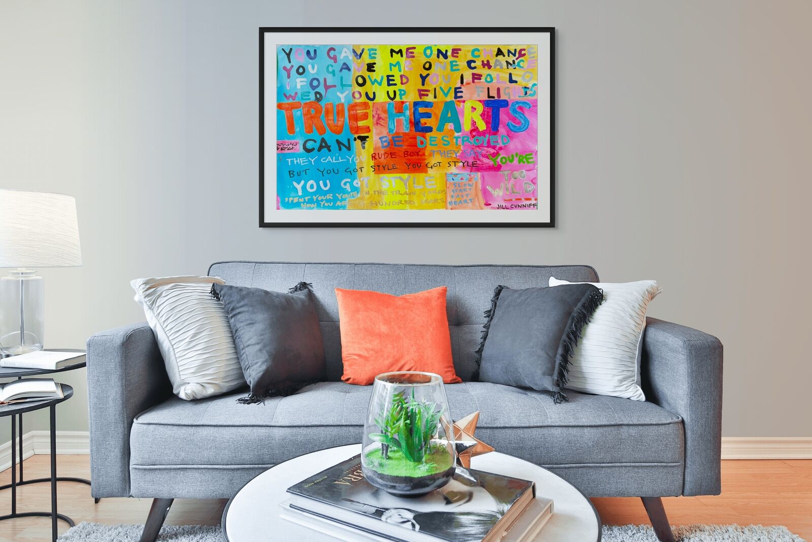 A painting with a quote on it that says true hearts can't be destroyed.