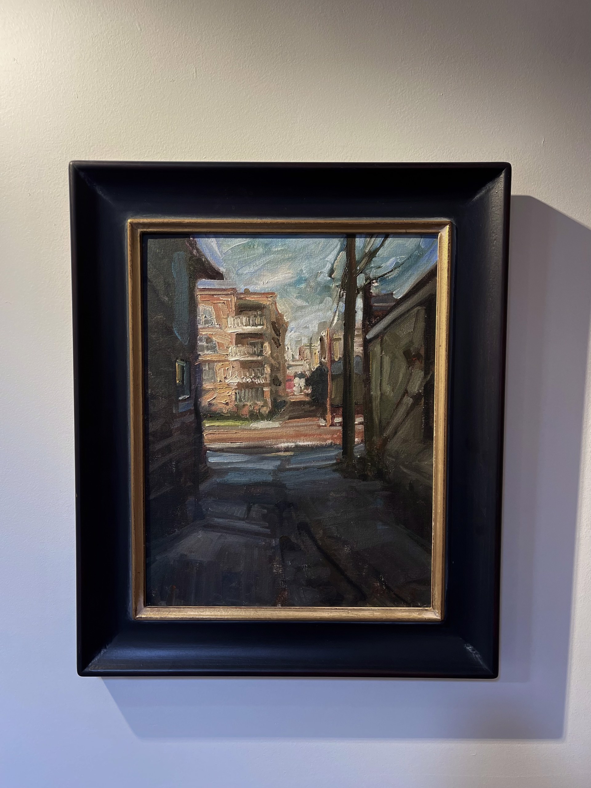 A painting of a city street with buildings in the background.