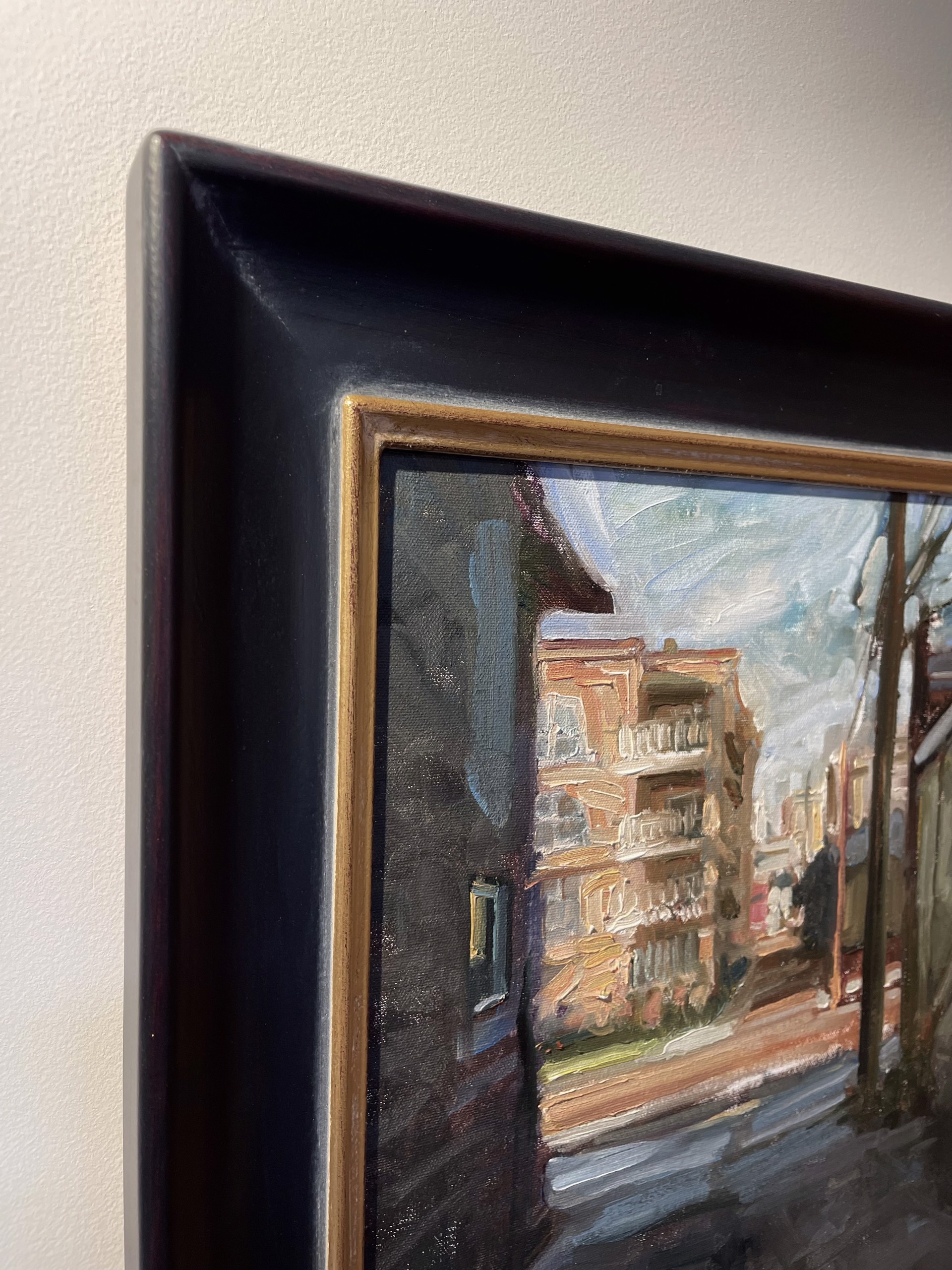 A painting of a city street with buildings in the background.