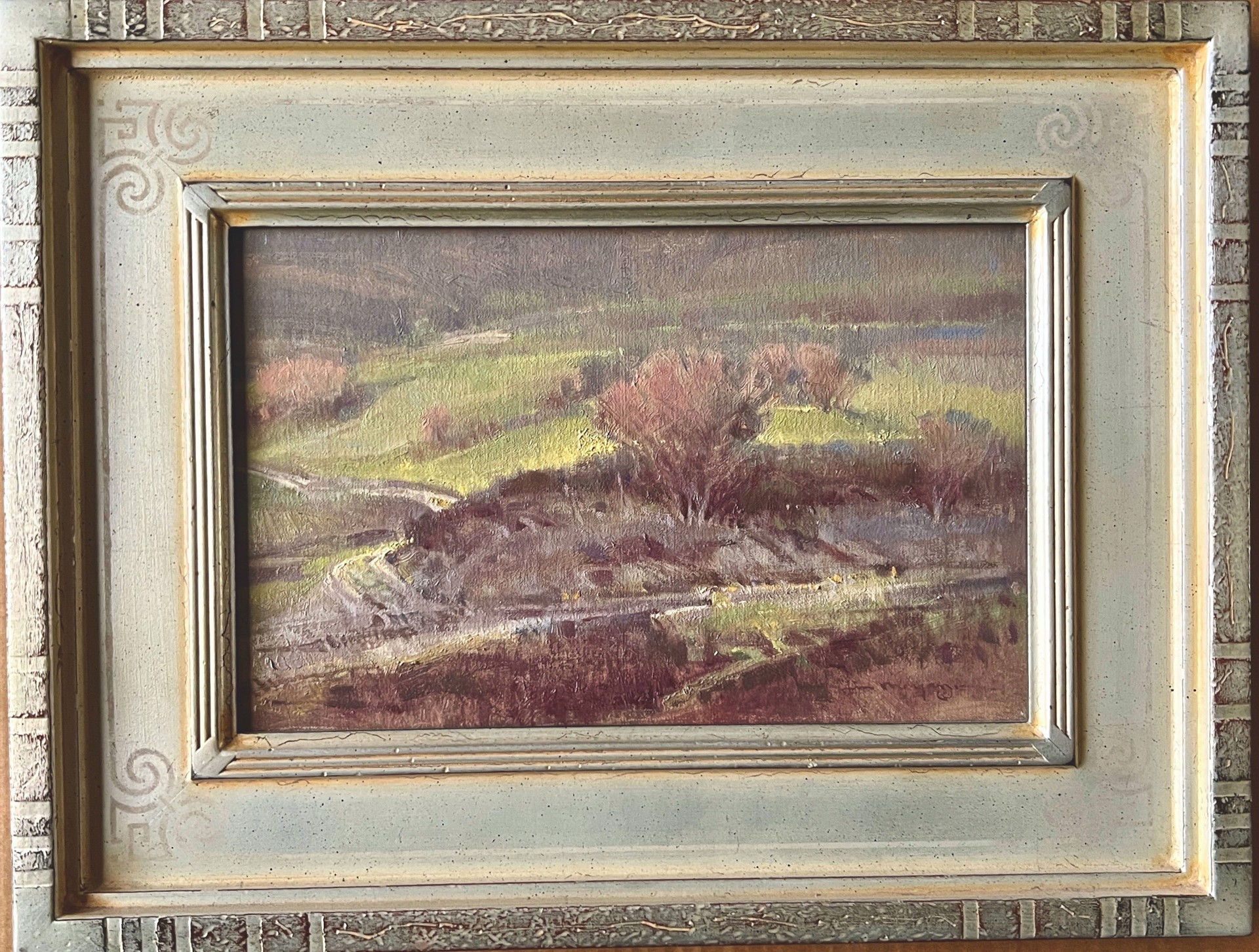 A painting of a landscape with trees in the distance.