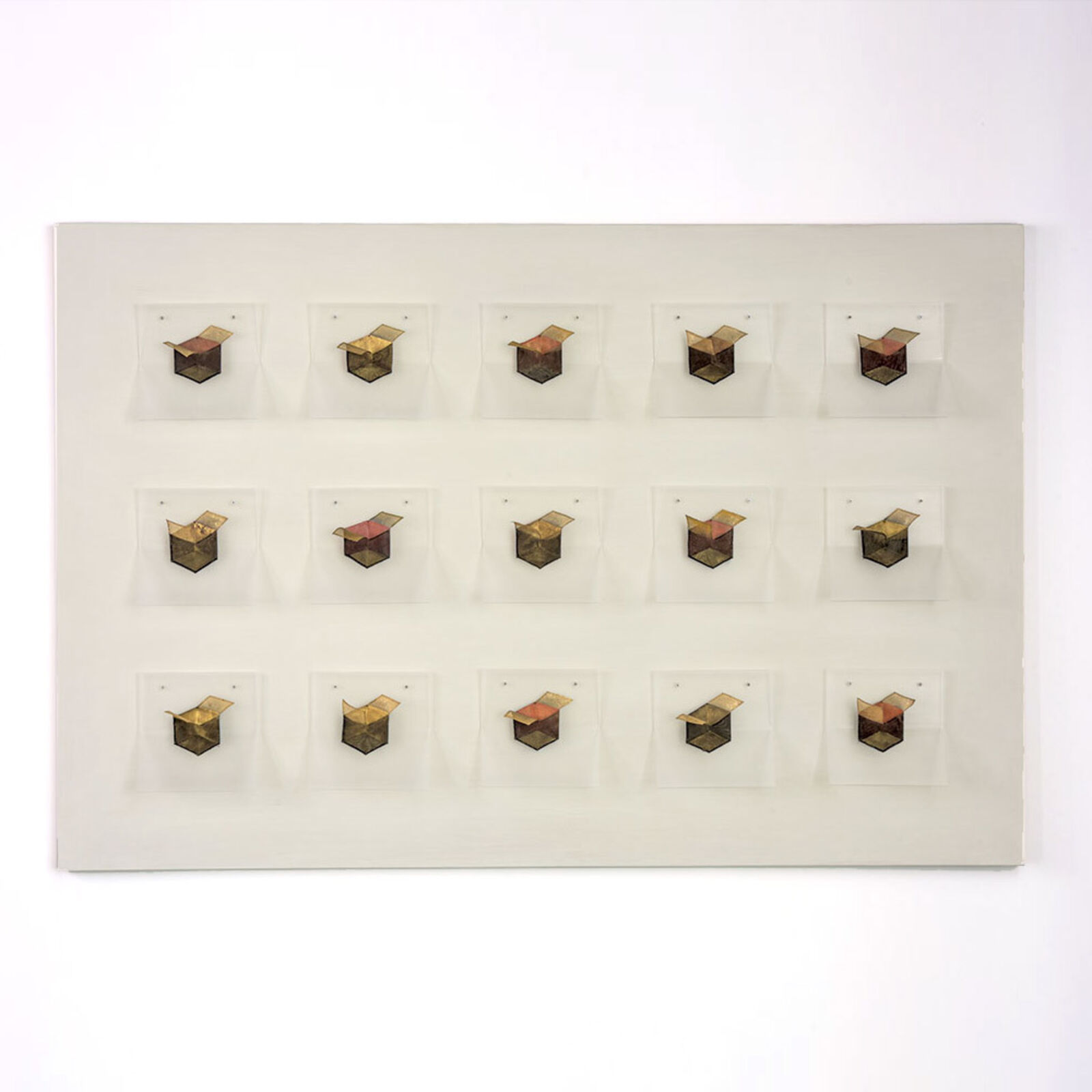 A grid of small, box-like objects arranged in three rows against a plain background.