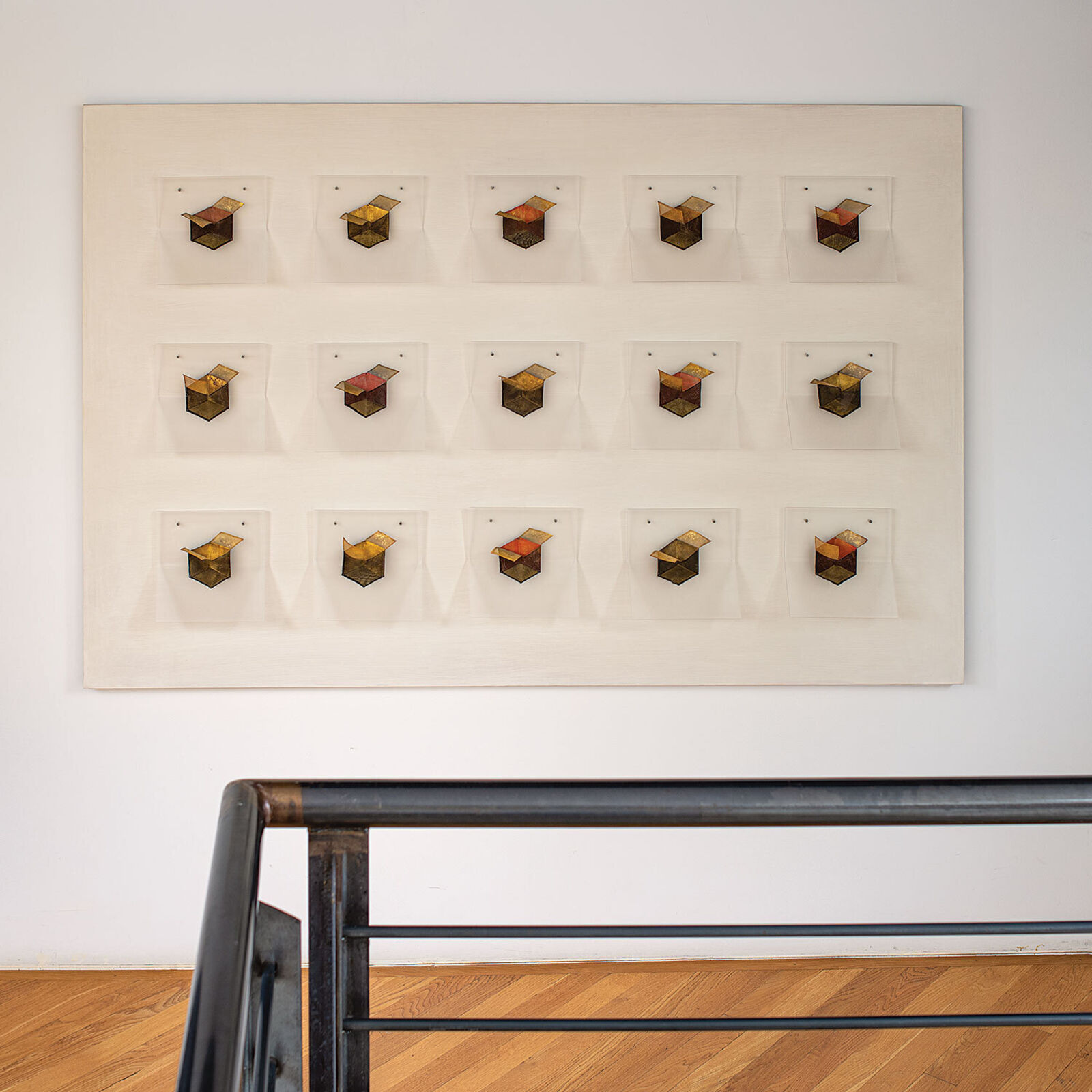 A grid of small, box-like objects arranged in three rows against a plain background.