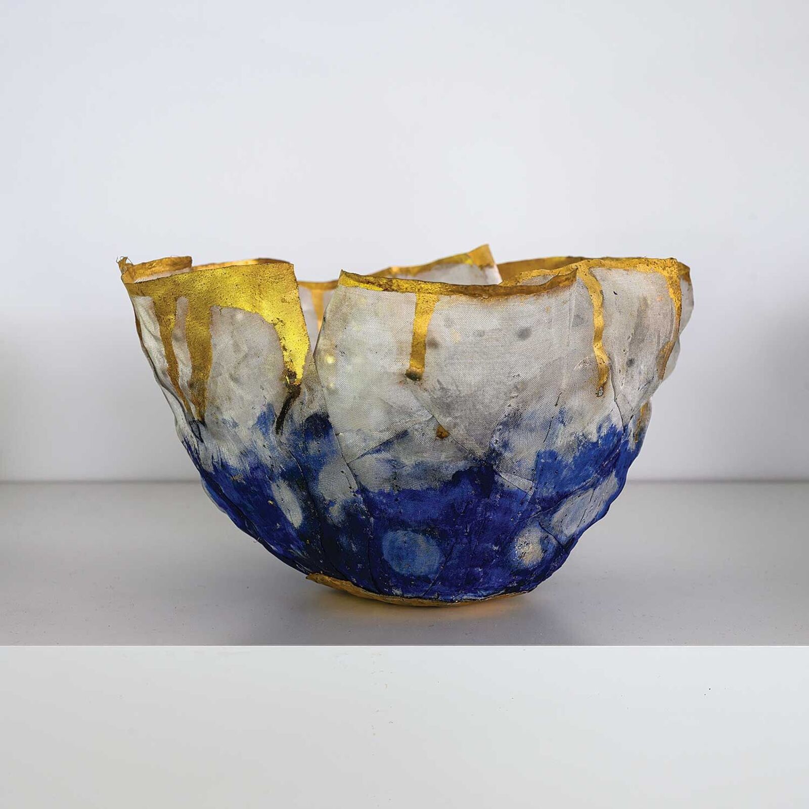 A blue and white bowl sitting on top of a table.