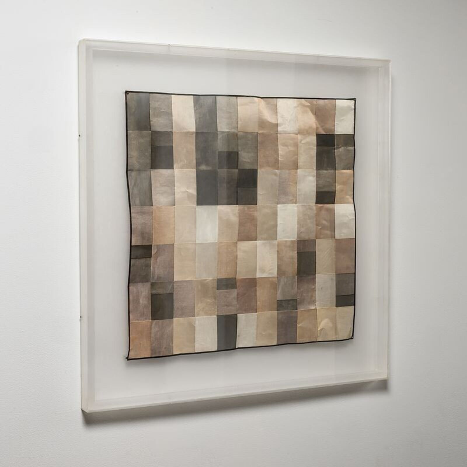 A picture of a piece of art hanging on a wall.