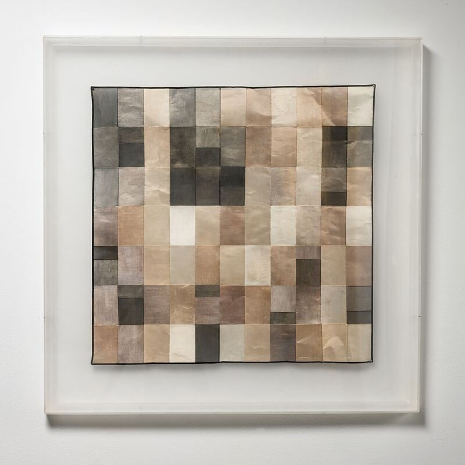 A picture of a piece of art hanging on a wall.