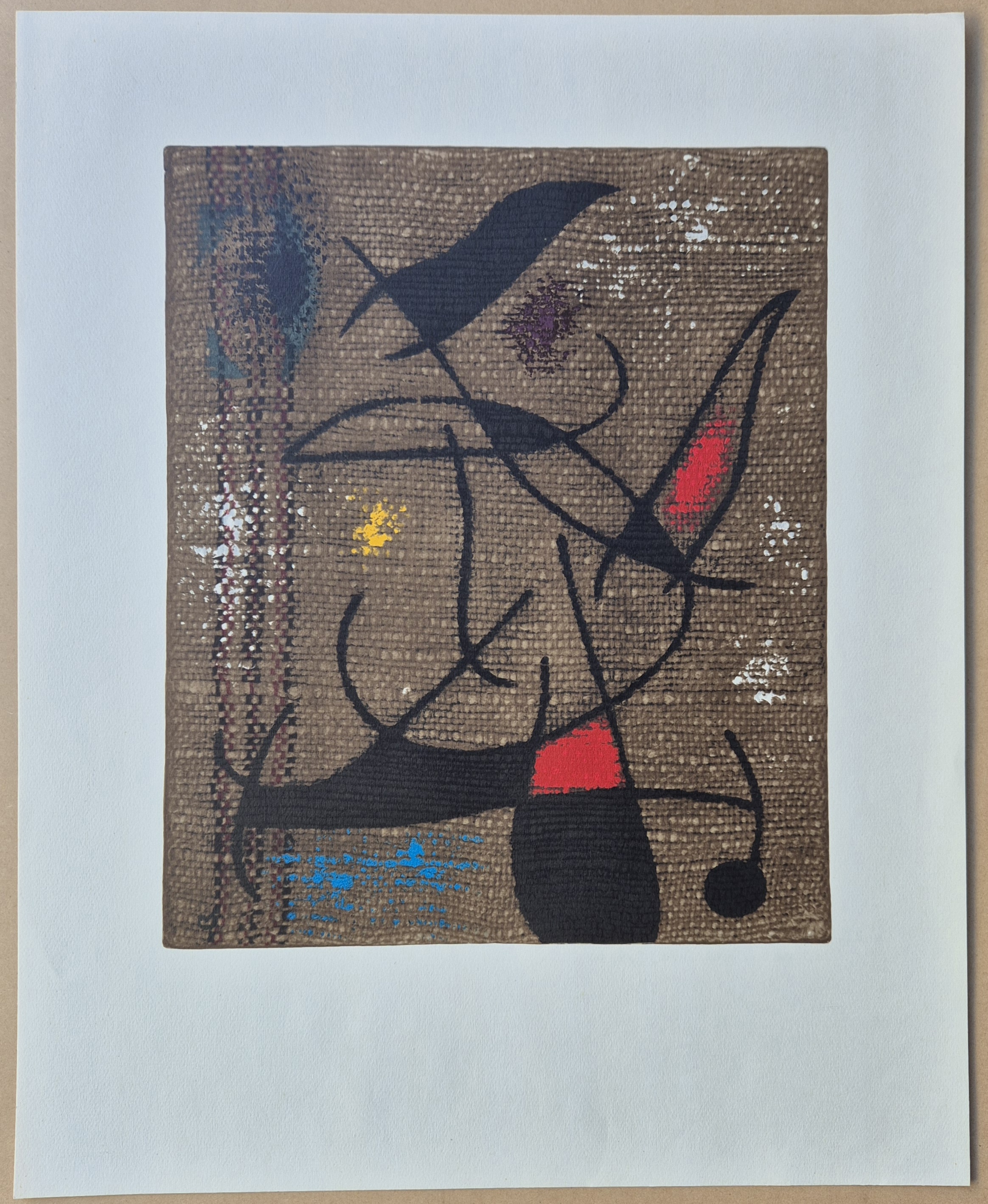 A textured abstract composition featuring bold black lines and splashes of red, blue, and yellow against a woven brown background.