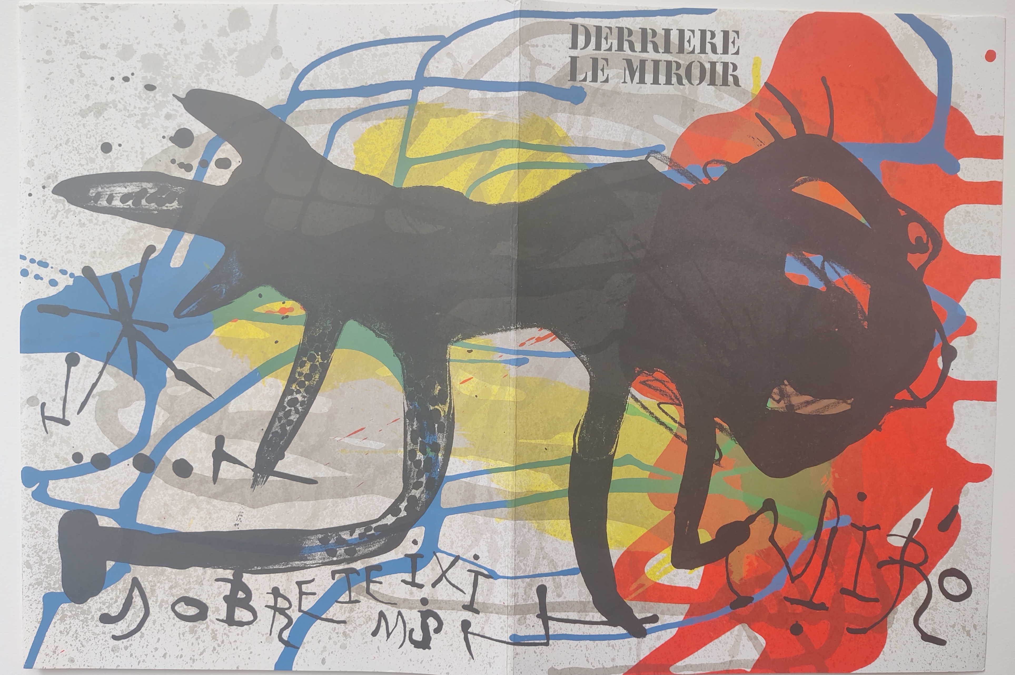 A painting of a black cat on a colorful background.