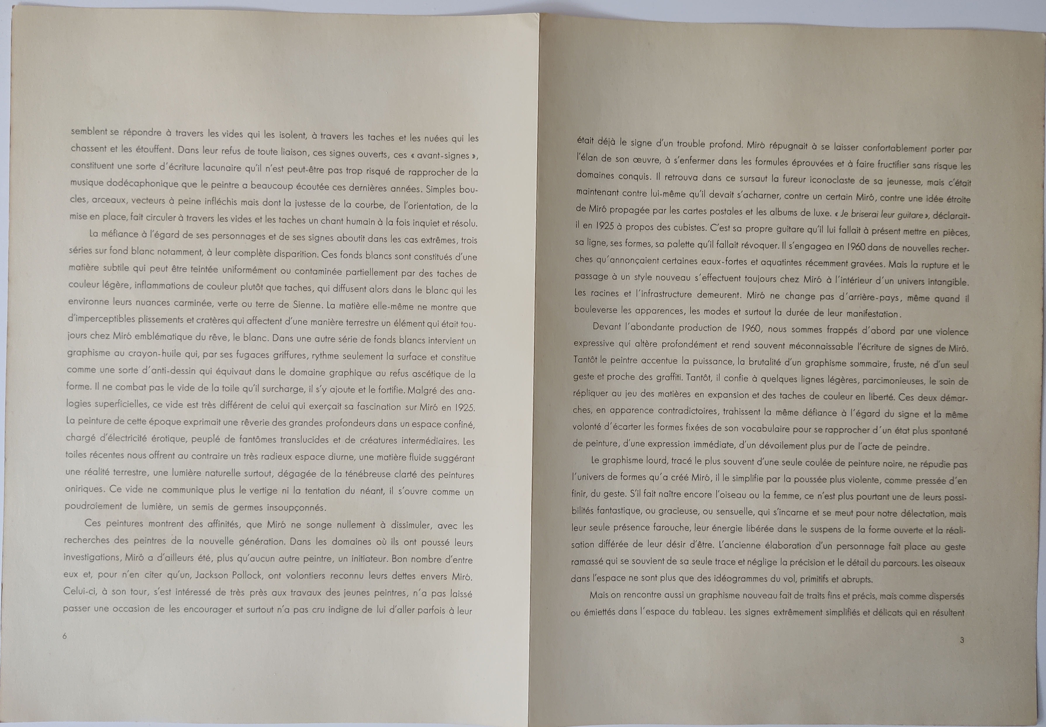 A book with a drawing of a red and black design on it.