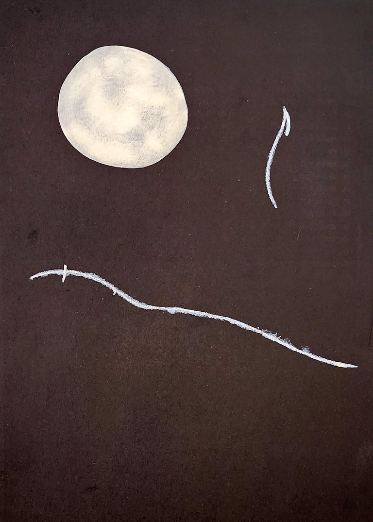 A drawing of a smiley face with a full moon in the background.