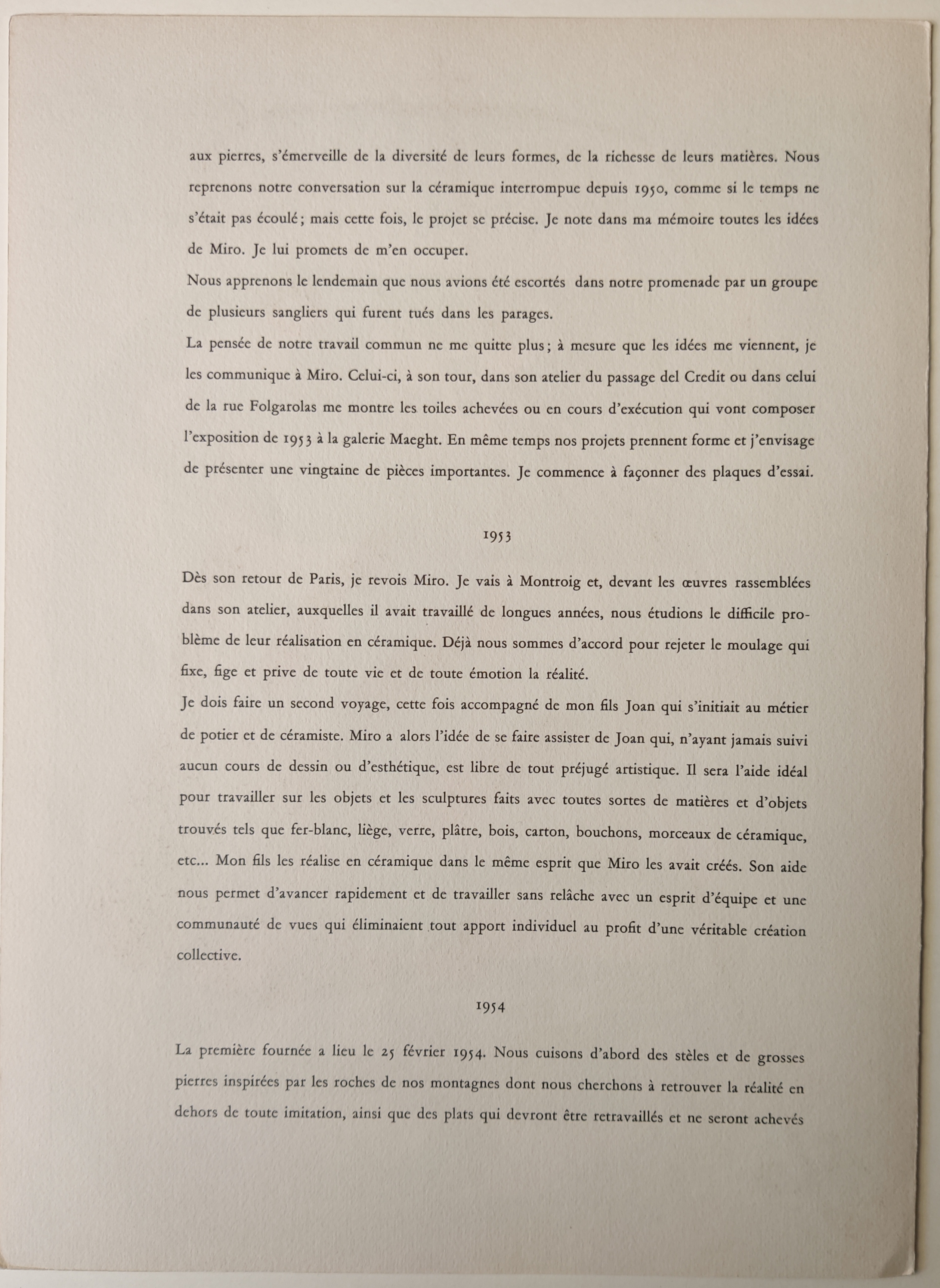 A green and red painting on a white wall.