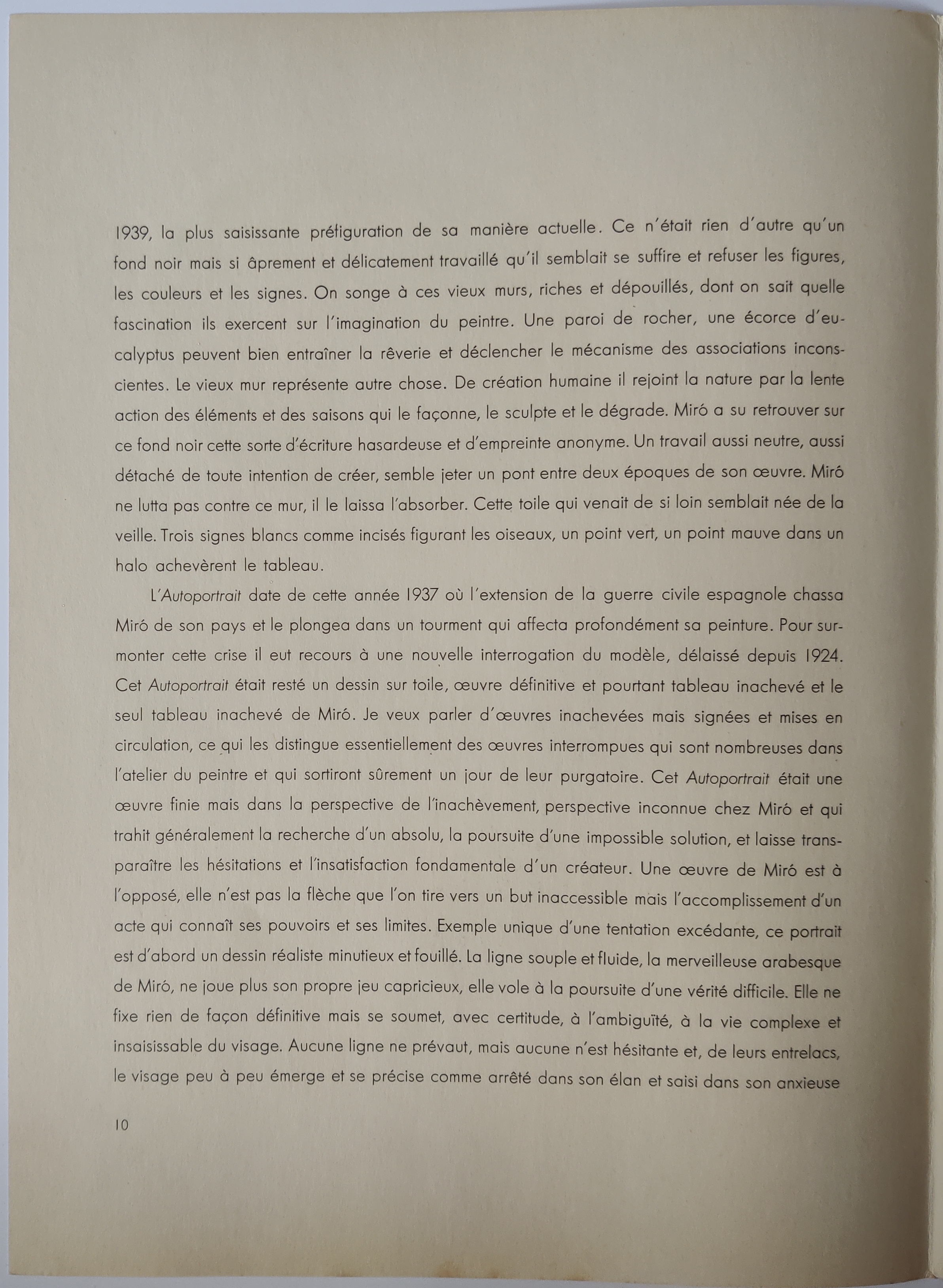 A book with a yellow circle and a pink dot on it.