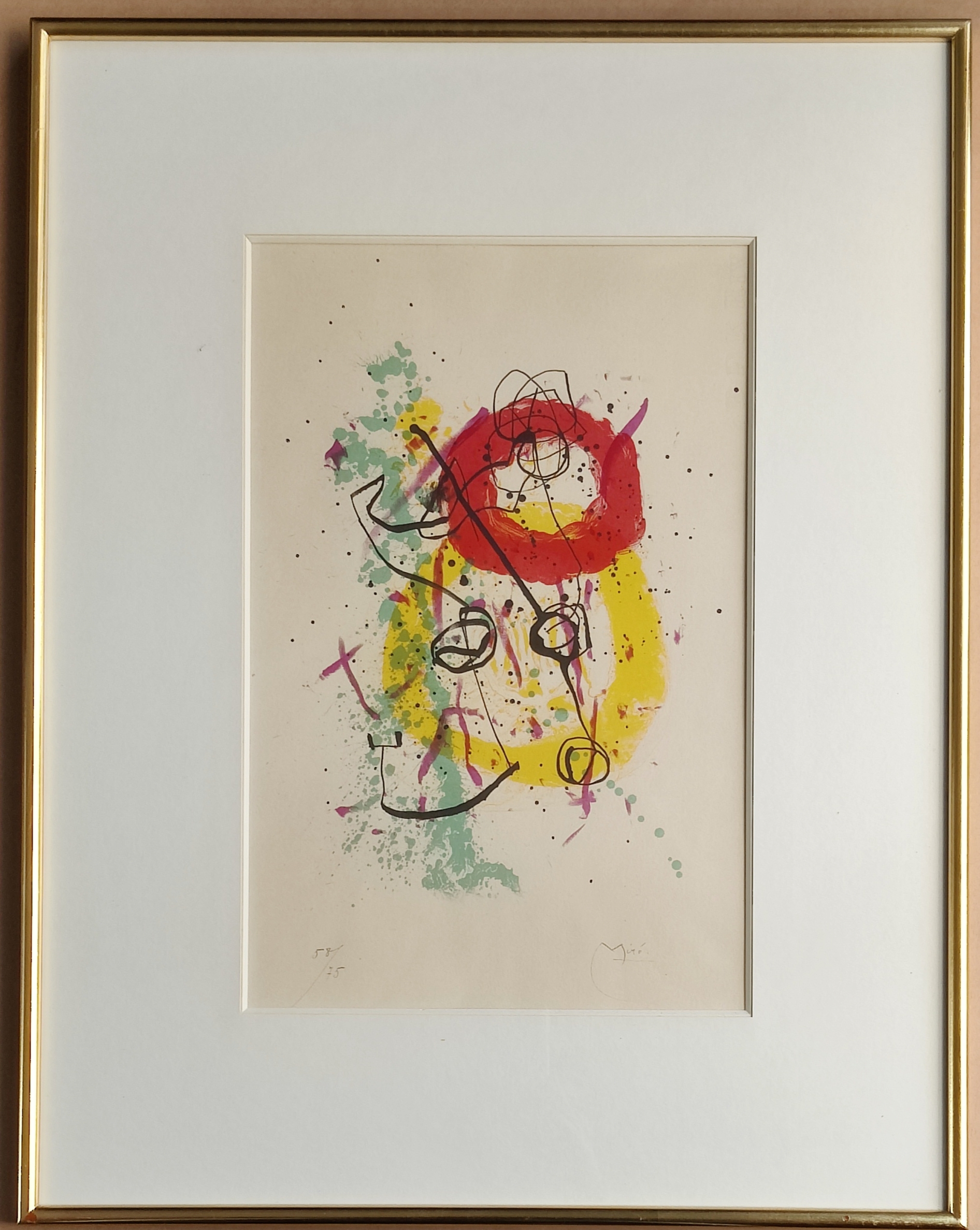 A framed painting of a colorful abstract painting in a gold frame.