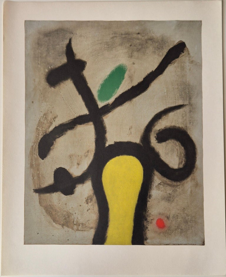 A painting of a yellow vase with a green leaf on it.