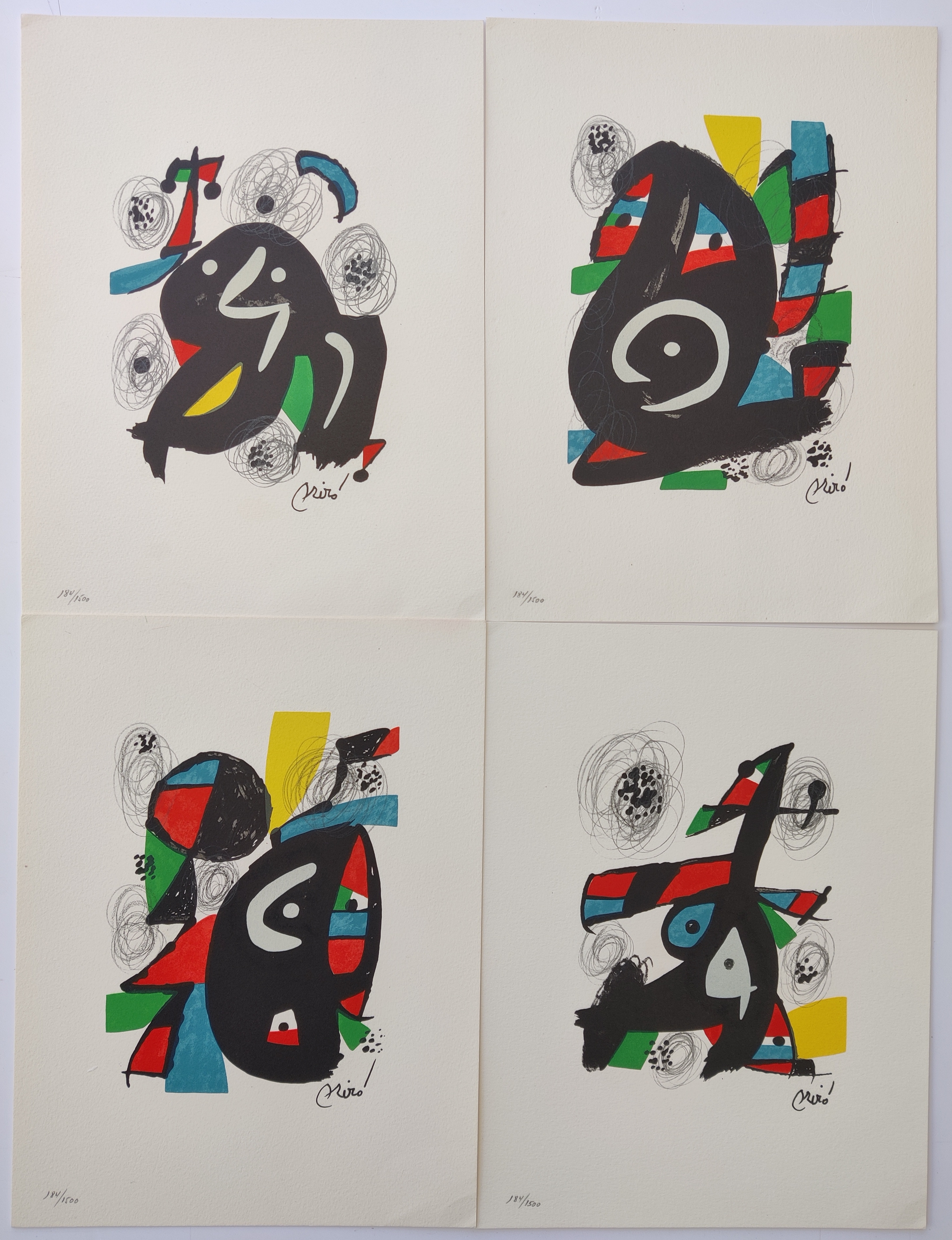 A set of six black and white prints on a white wall.