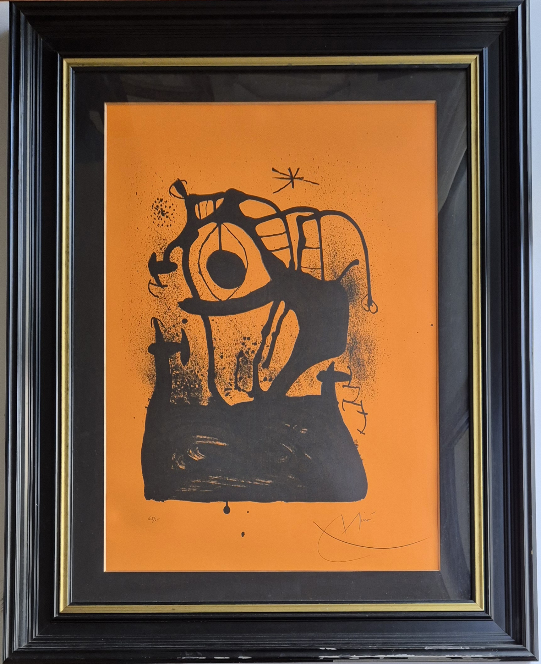 A bold black ink print on orange paper featuring a surreal, abstract figure with an eye motif.