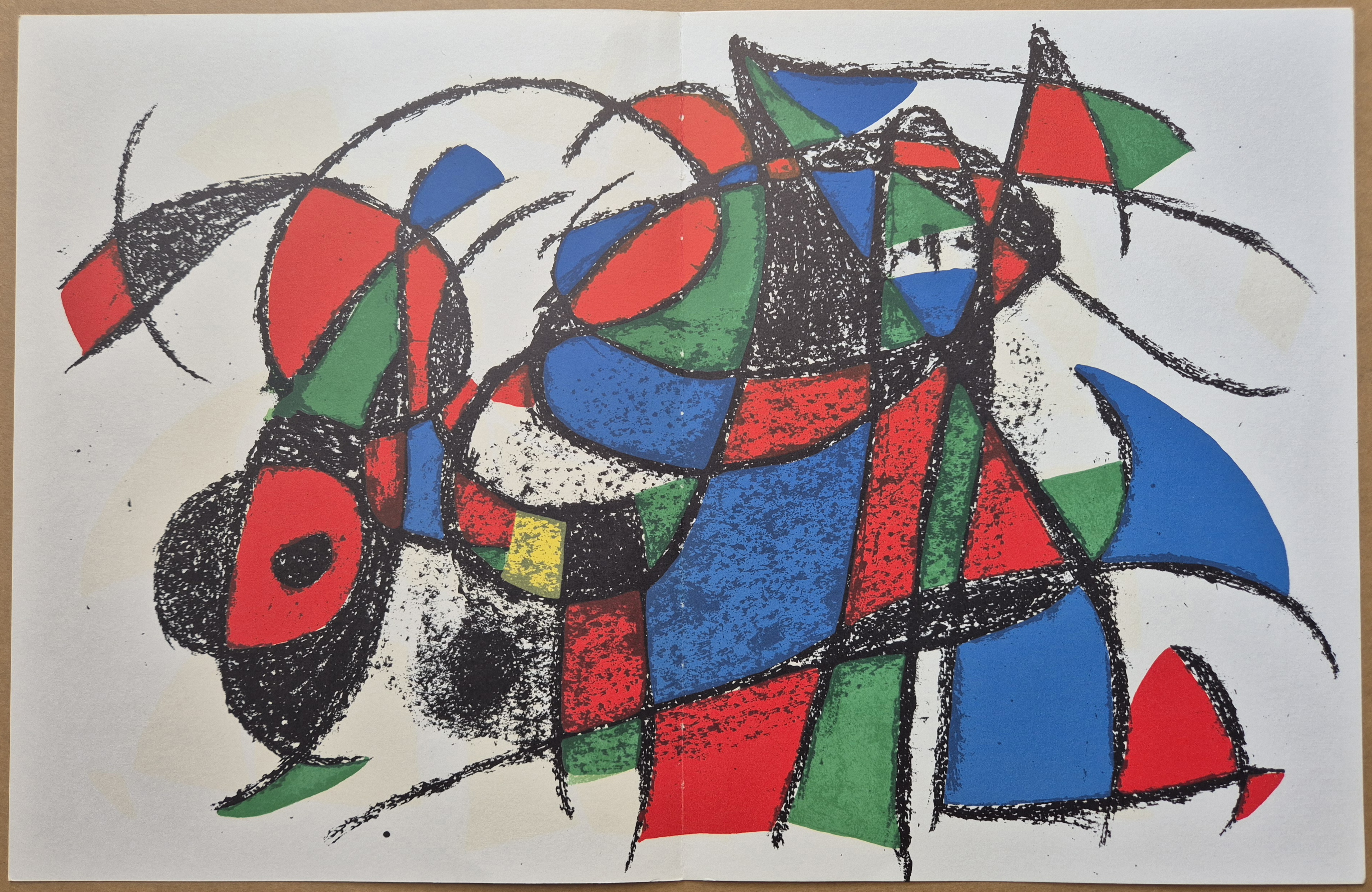 A drawing of a colorful abstract painting on a piece of paper.