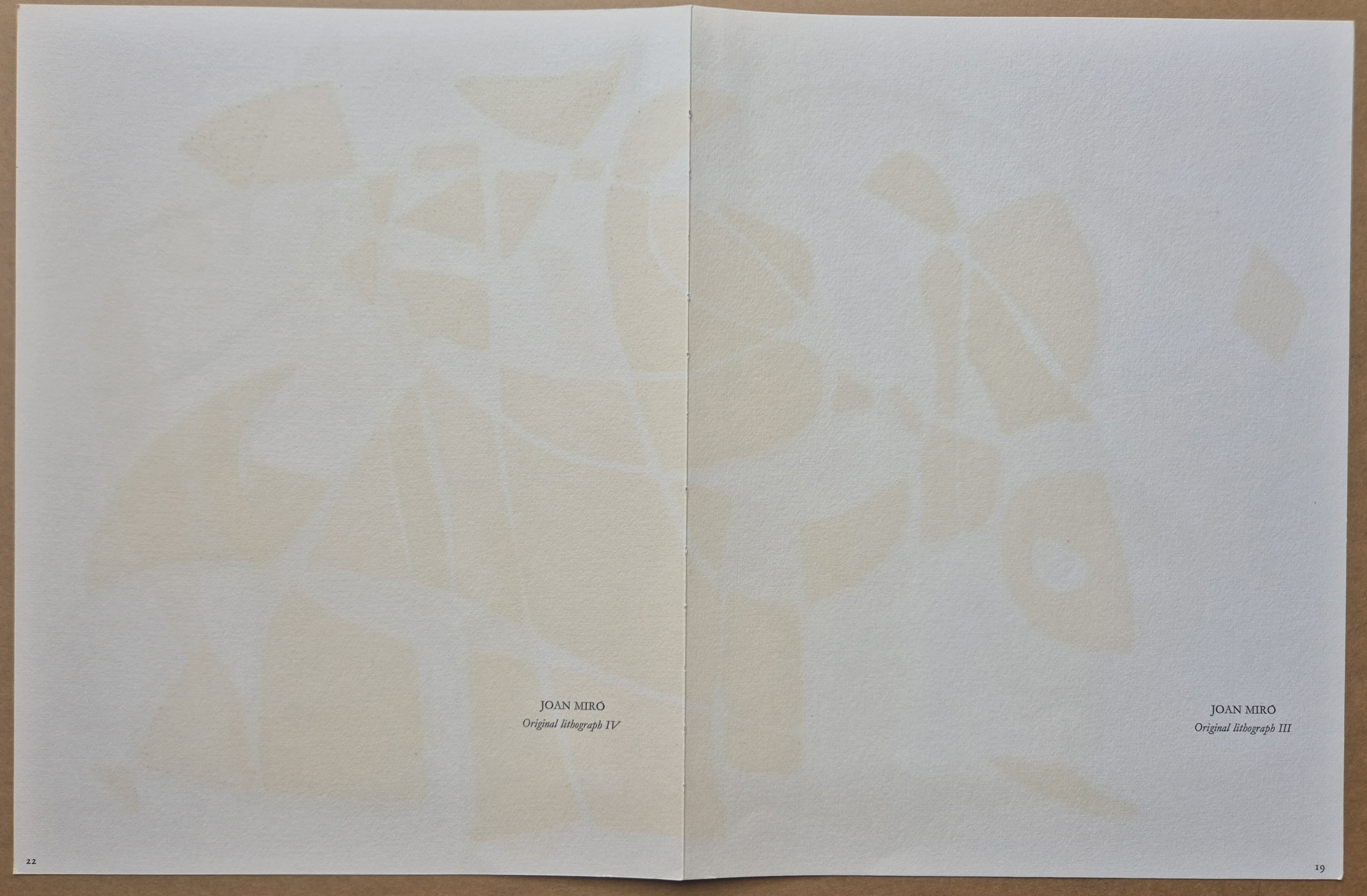 A drawing of a colorful abstract painting on a piece of paper.