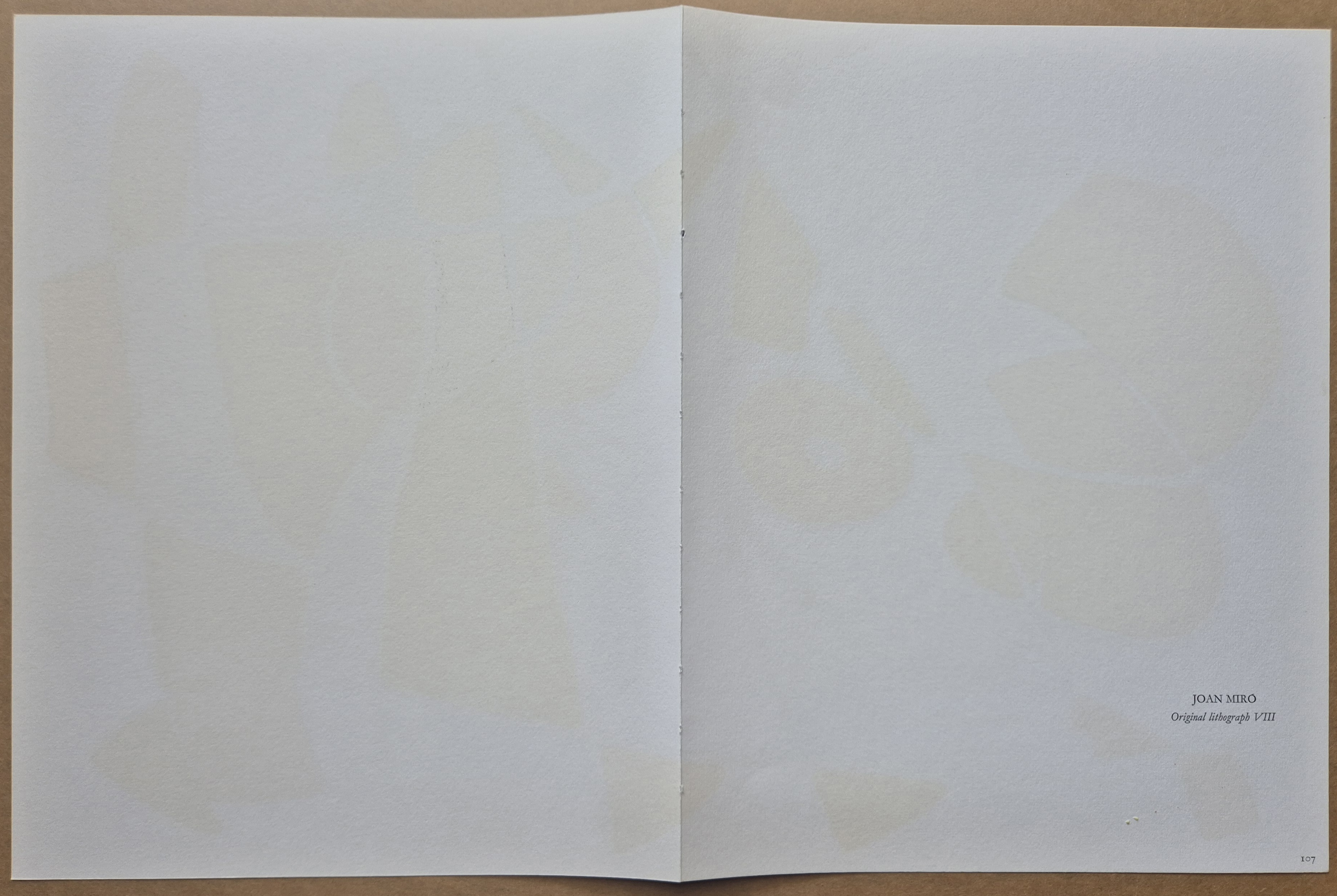 A drawing of a colorful abstract painting on a piece of paper.