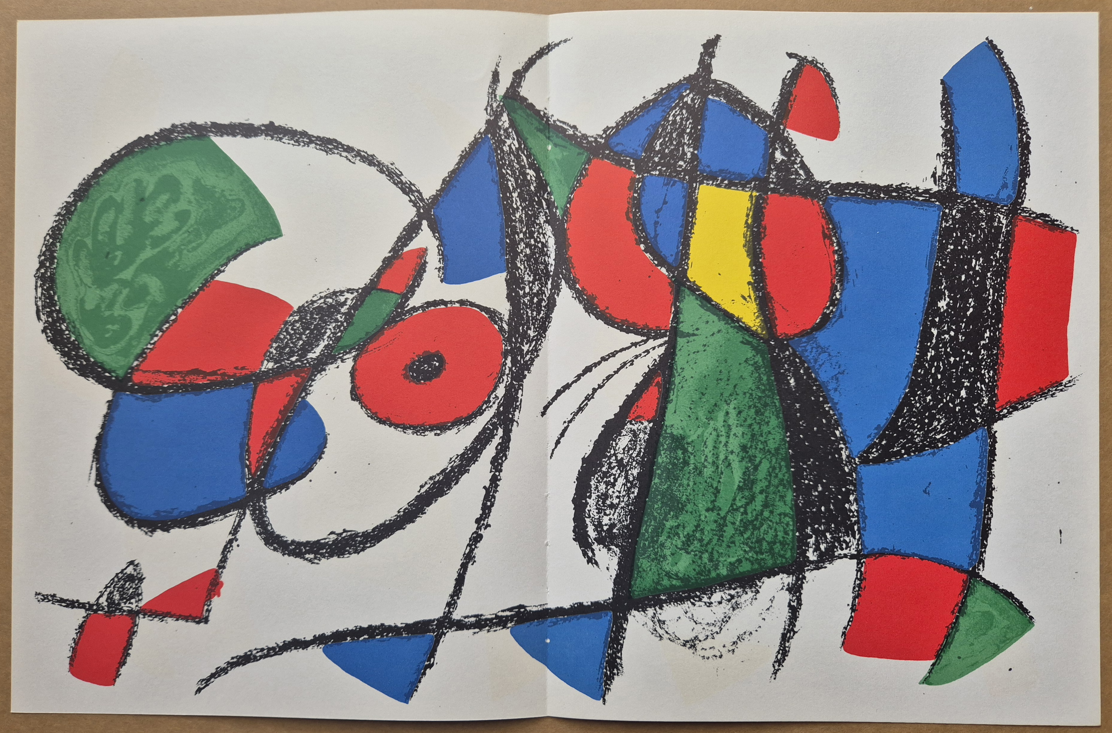 A drawing of a colorful abstract painting on a piece of paper.