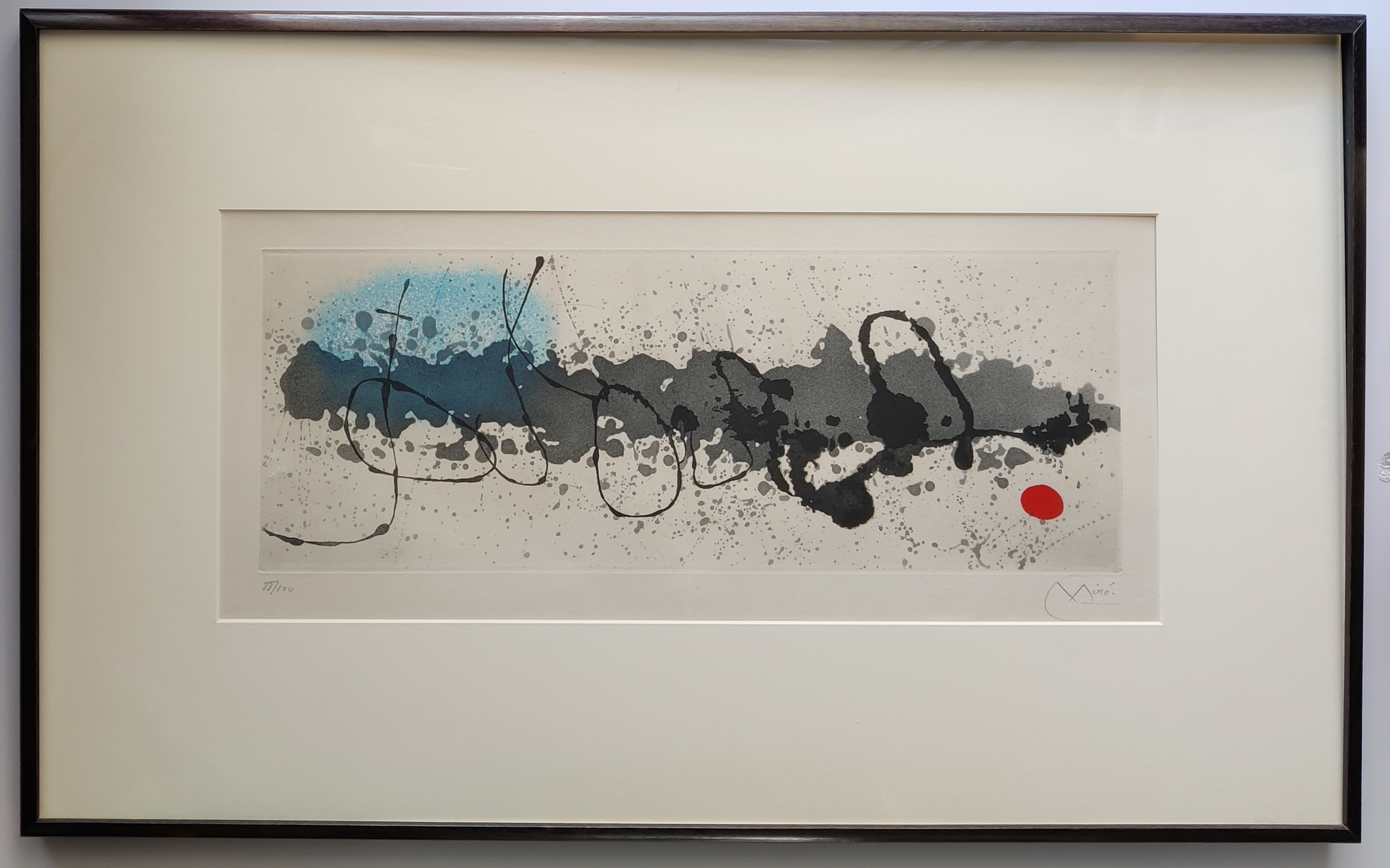 A black and white painting with a red dot in the middle.