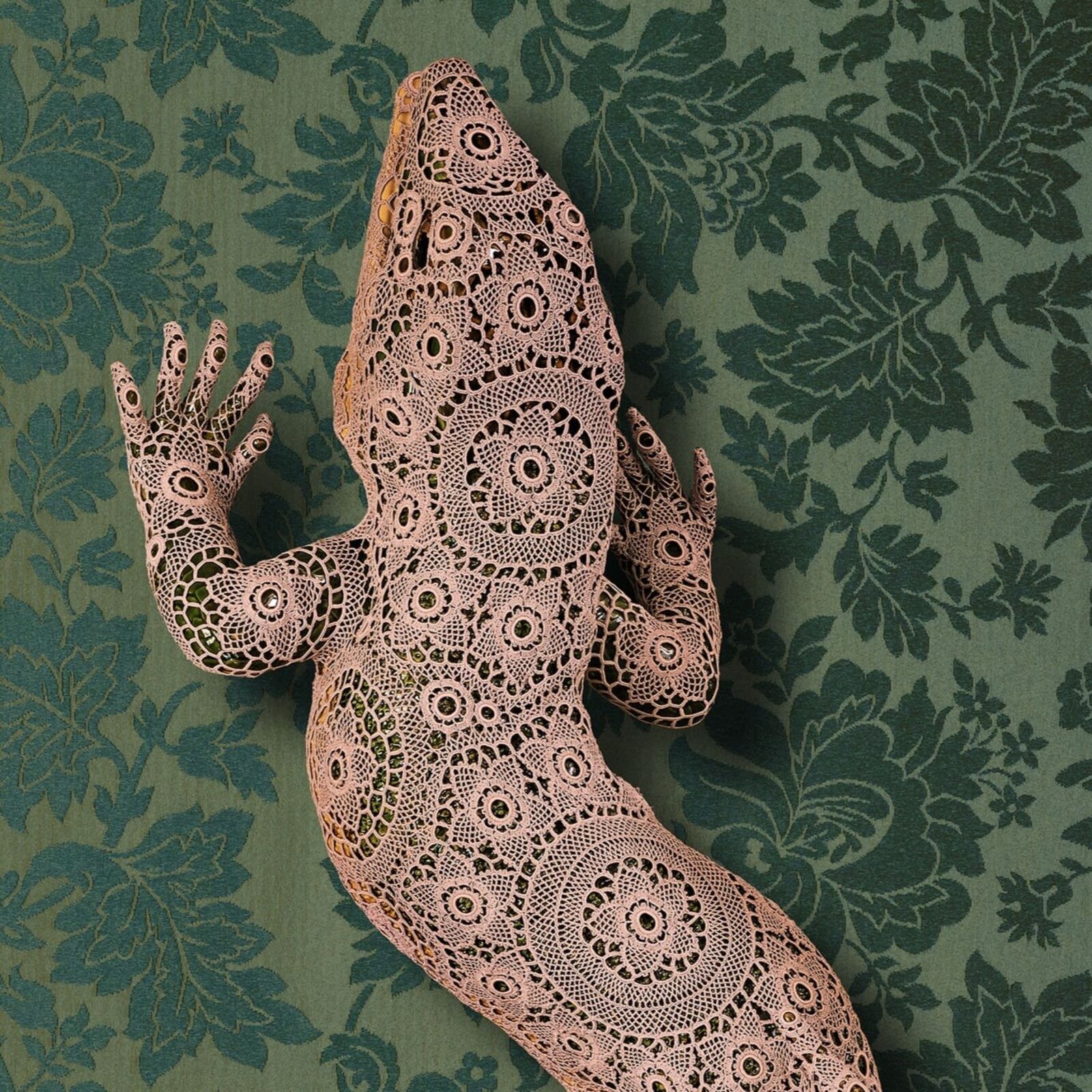 A lizard made out of paper on a green background.