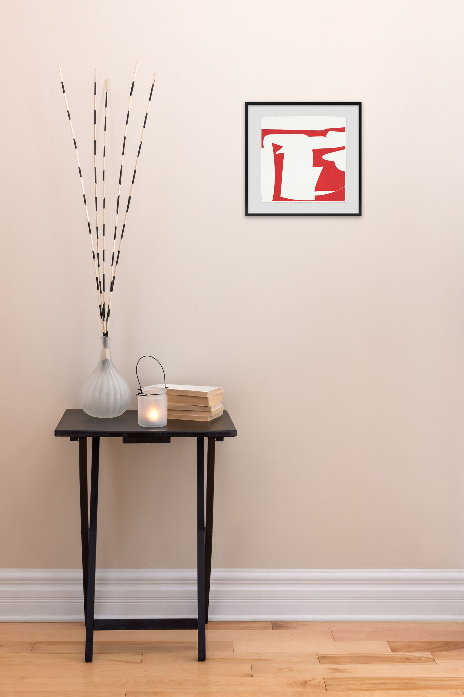 A red and white painting on a white background.