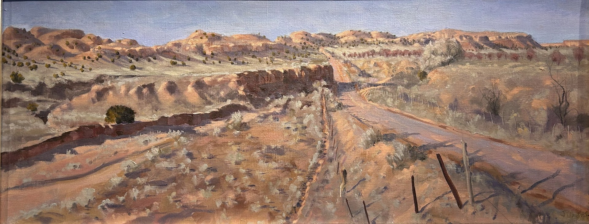 A painting of a dirt road in the desert.