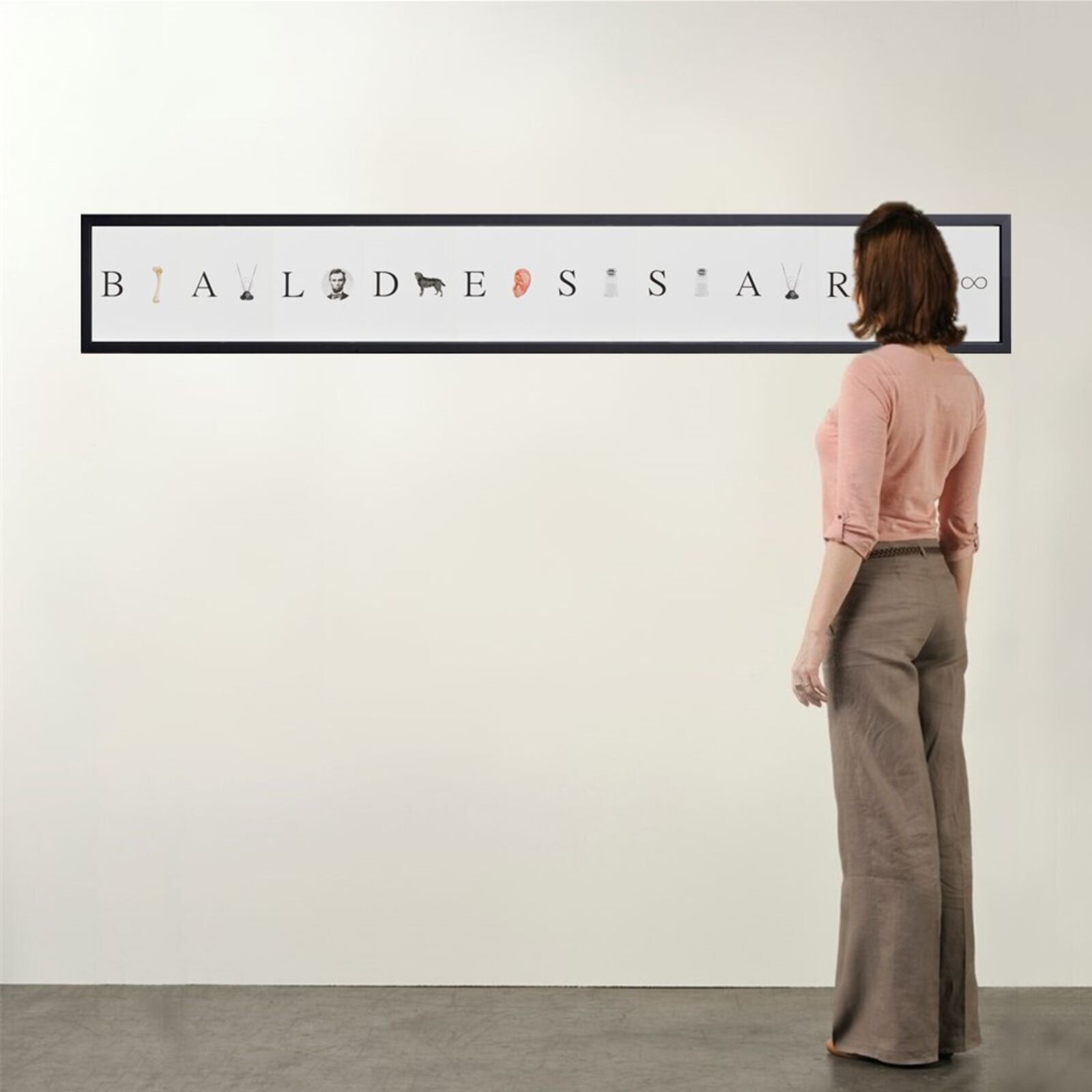 A minimalist framed artwork featuring a horizontal row of letters interspersed with small, varied icons against a plain background.