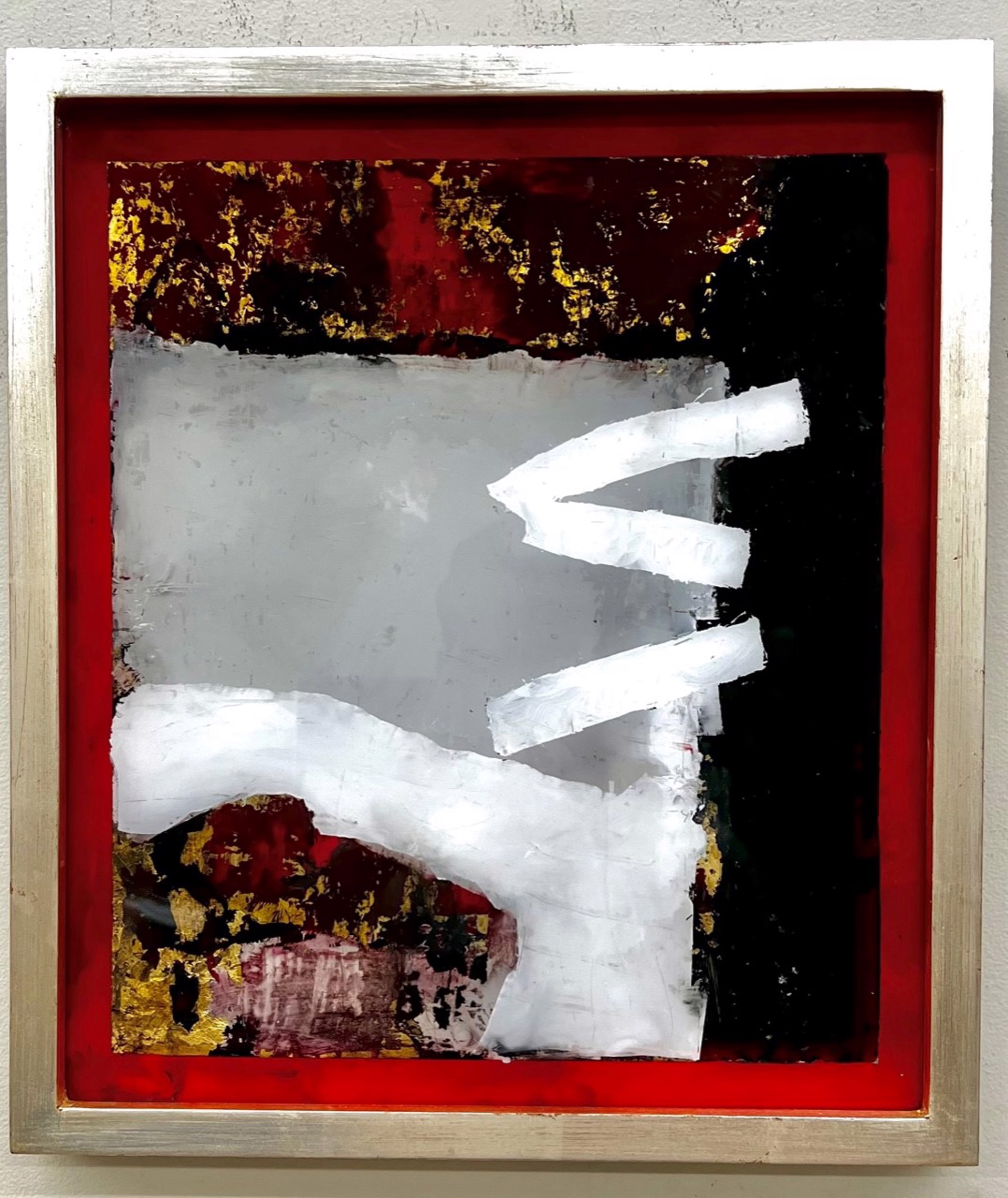 A painting hanging on a wall in a room.