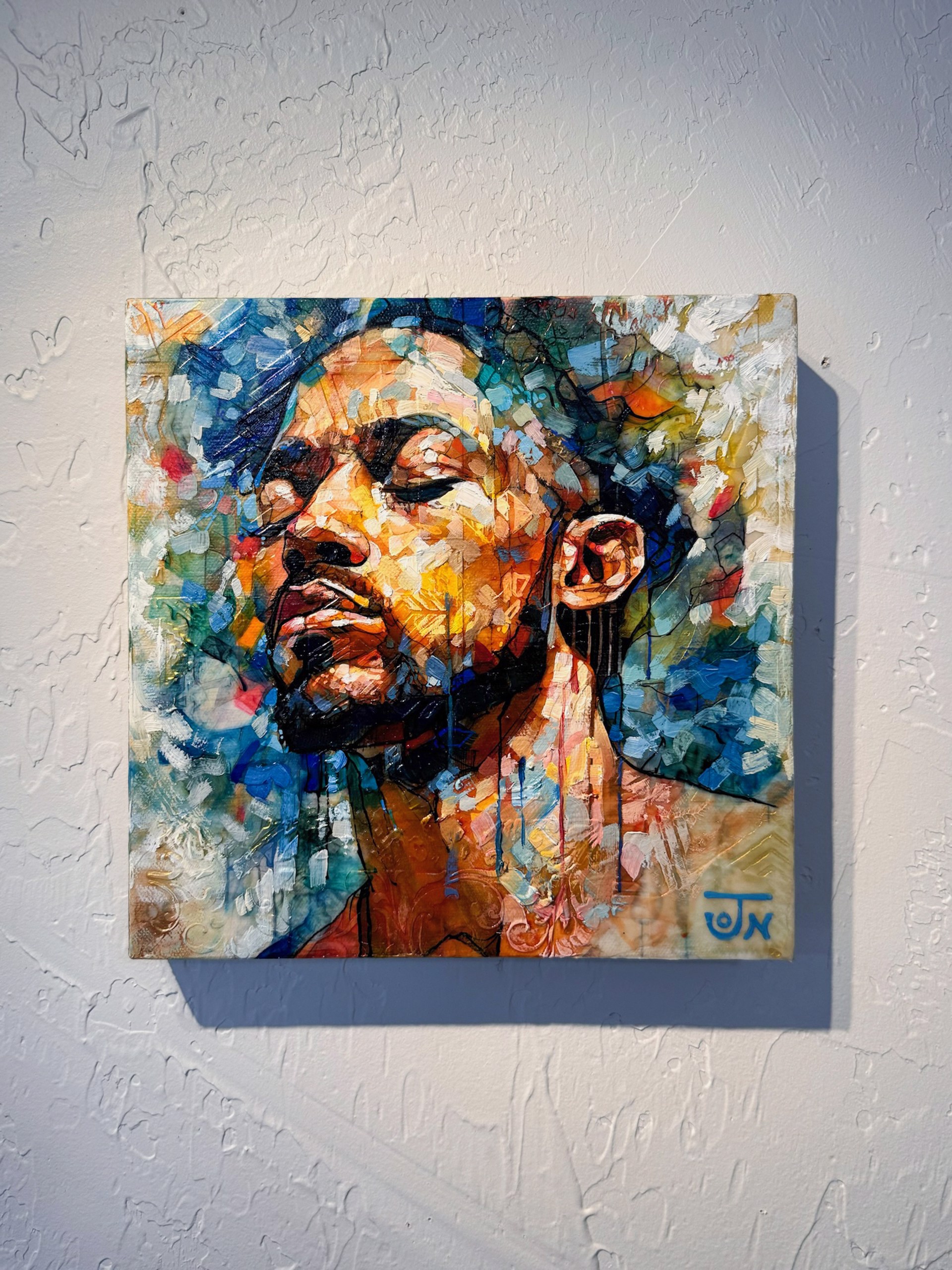 A painting of a man with his eyes closed.