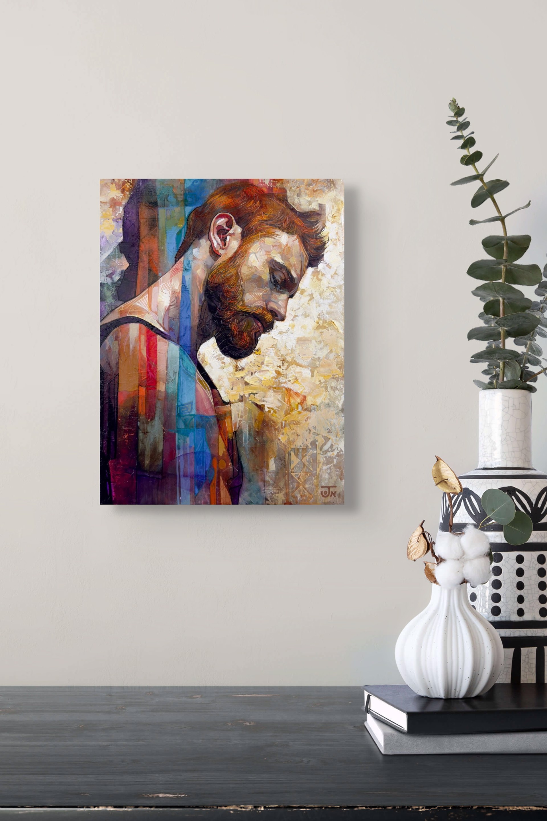A contemplative portrait of a bearded figure rendered in textured, layered brushstrokes.