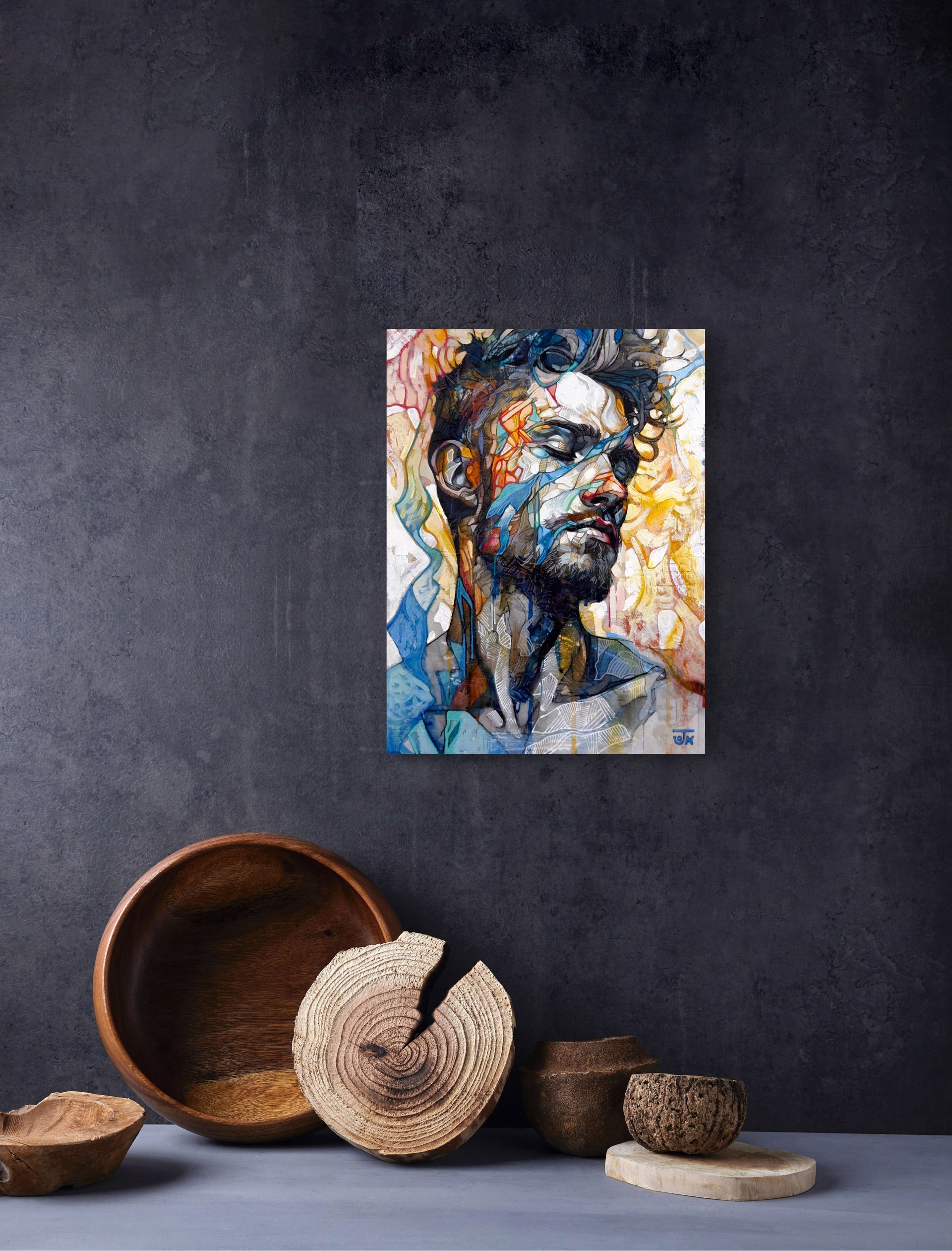 A portrait of a bearded figure with a fragmented, abstract face against a vibrant background.