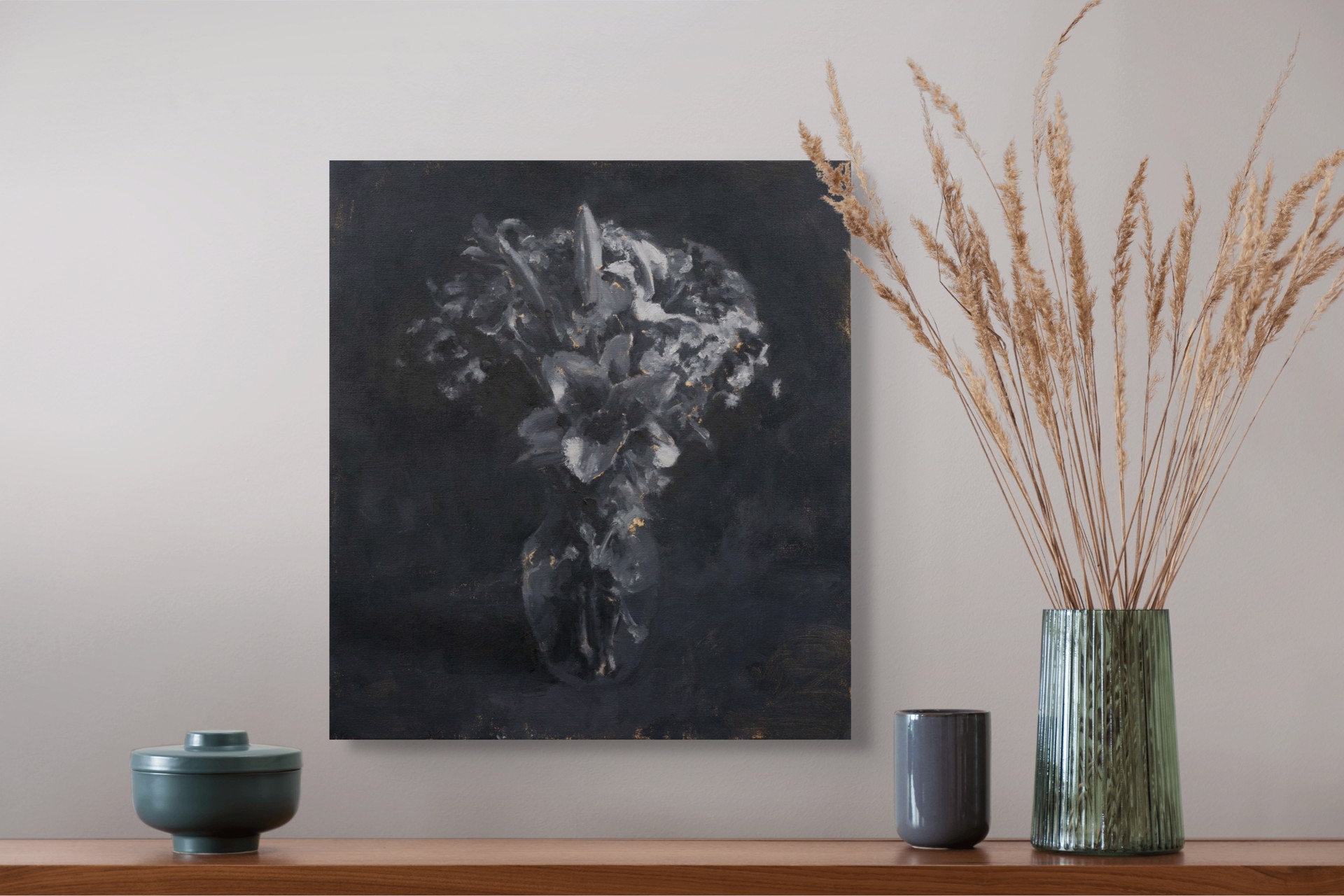 A monochromatic still life of lilies in a vase against a dark background.