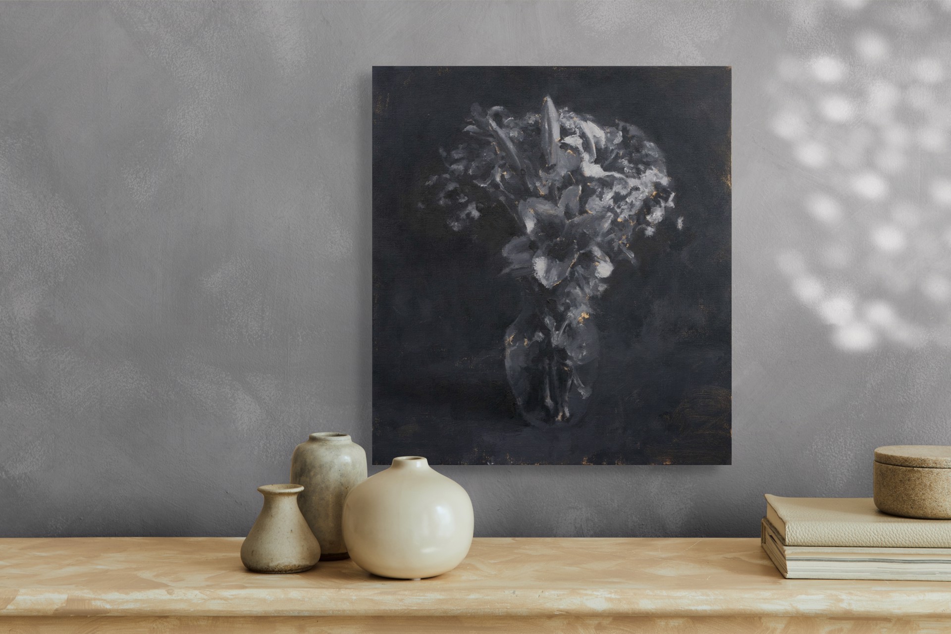 A monochromatic still life of lilies in a vase against a dark background.