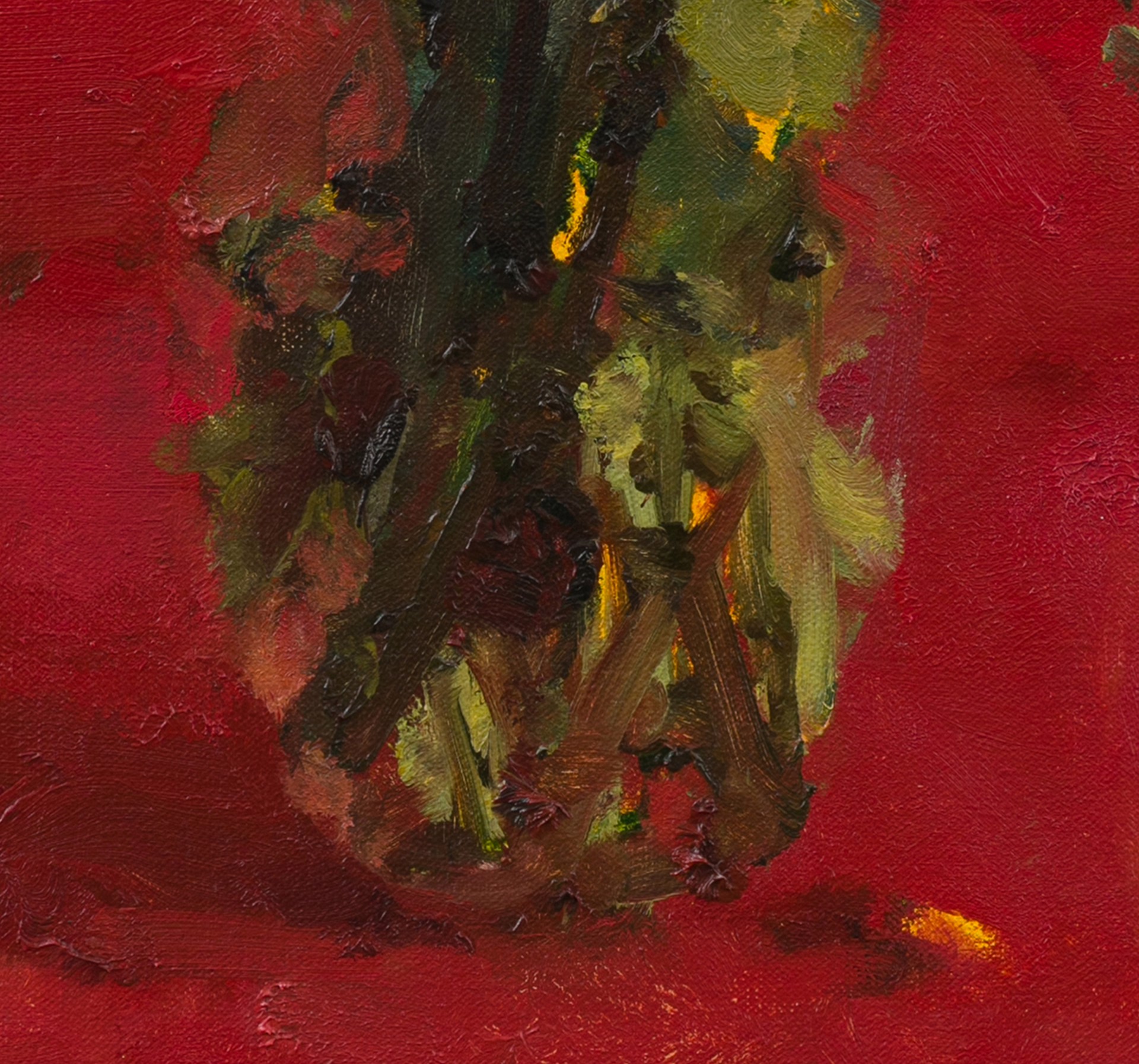 A vibrant still life of a colorful bouquet in a vase against a bold red background.