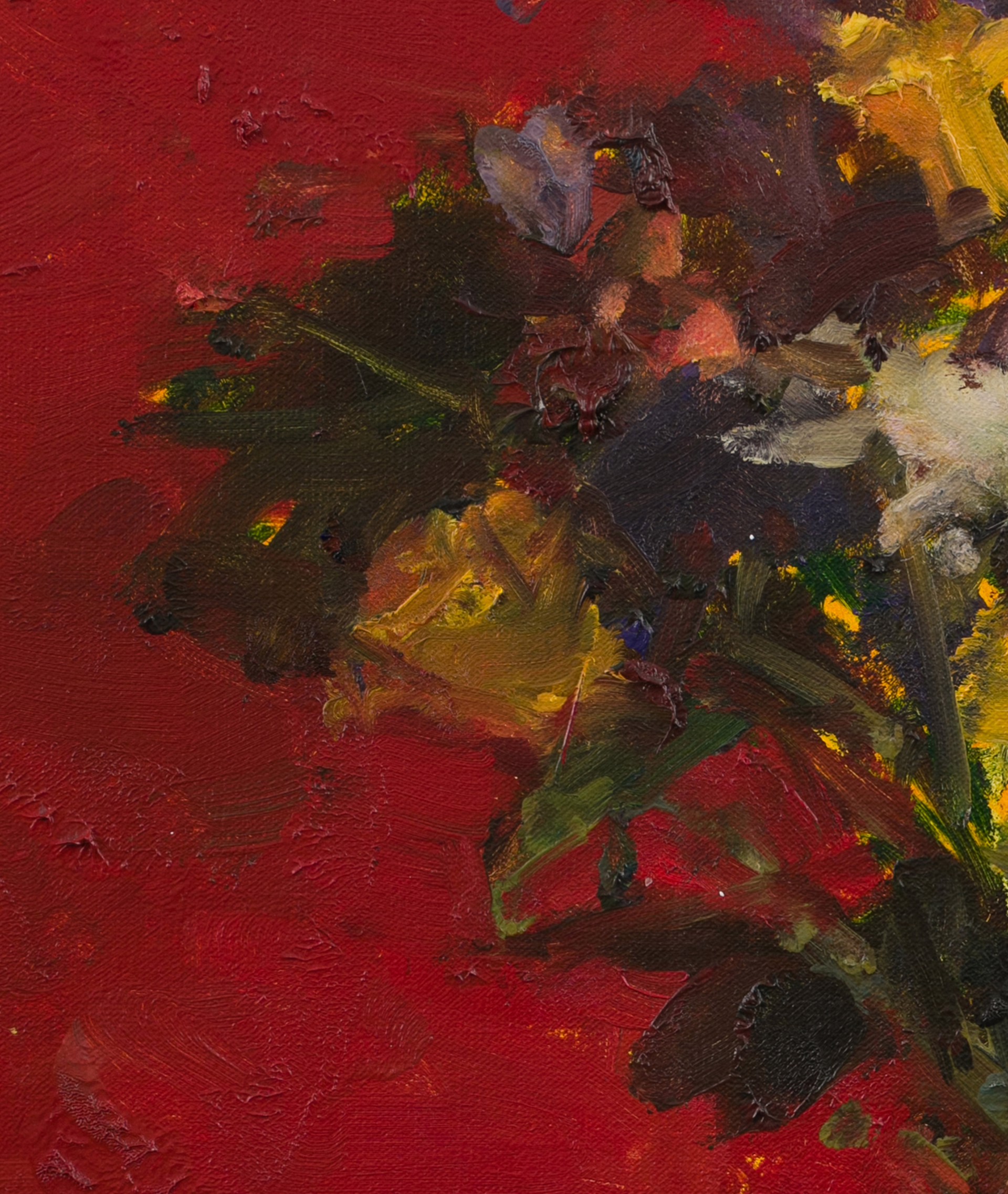 A vibrant still life of a colorful bouquet in a vase against a bold red background.