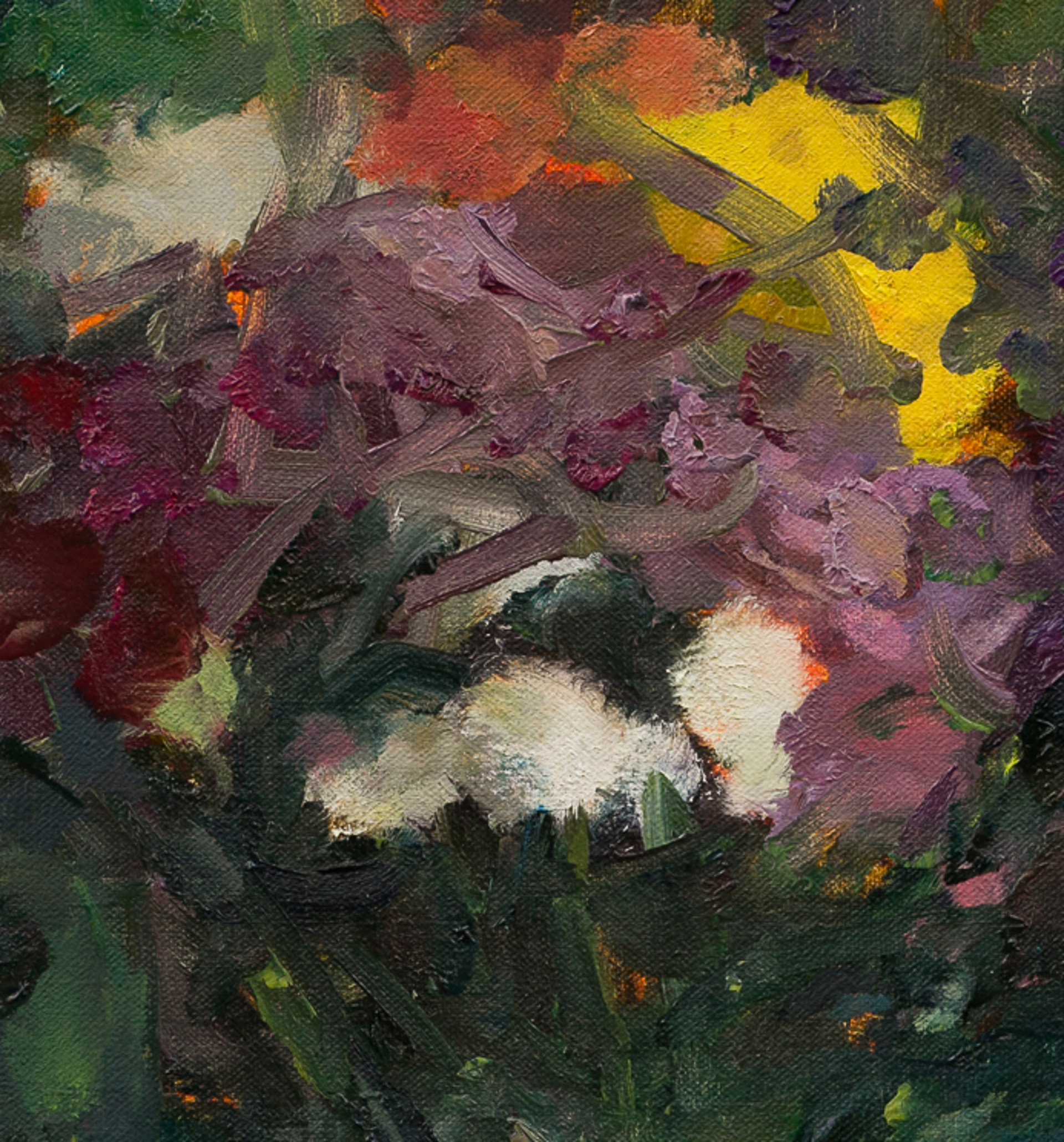 A vibrant bouquet of flowers in a vase against a dark teal background.