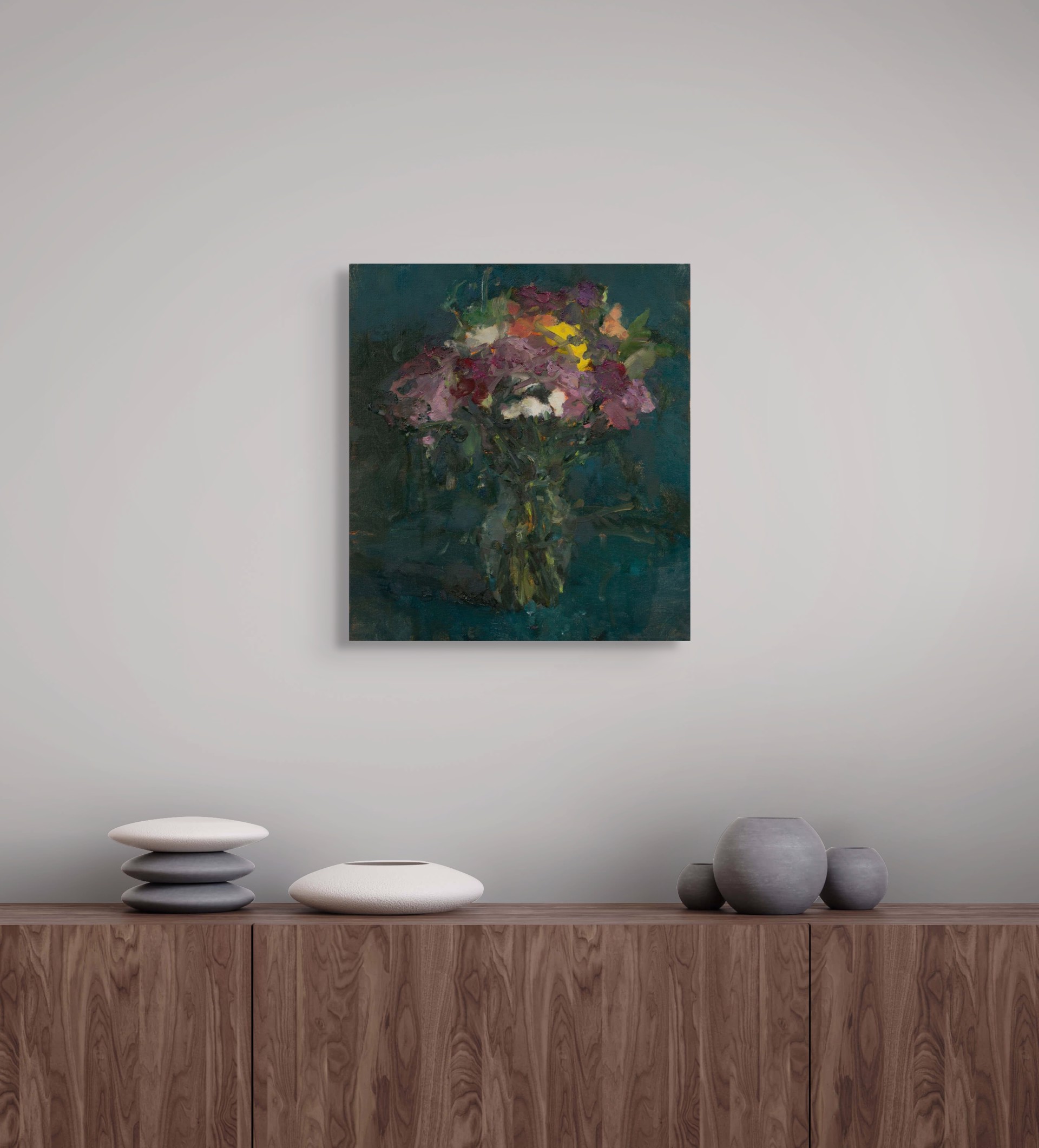 A vibrant bouquet of flowers in a vase against a dark teal background.