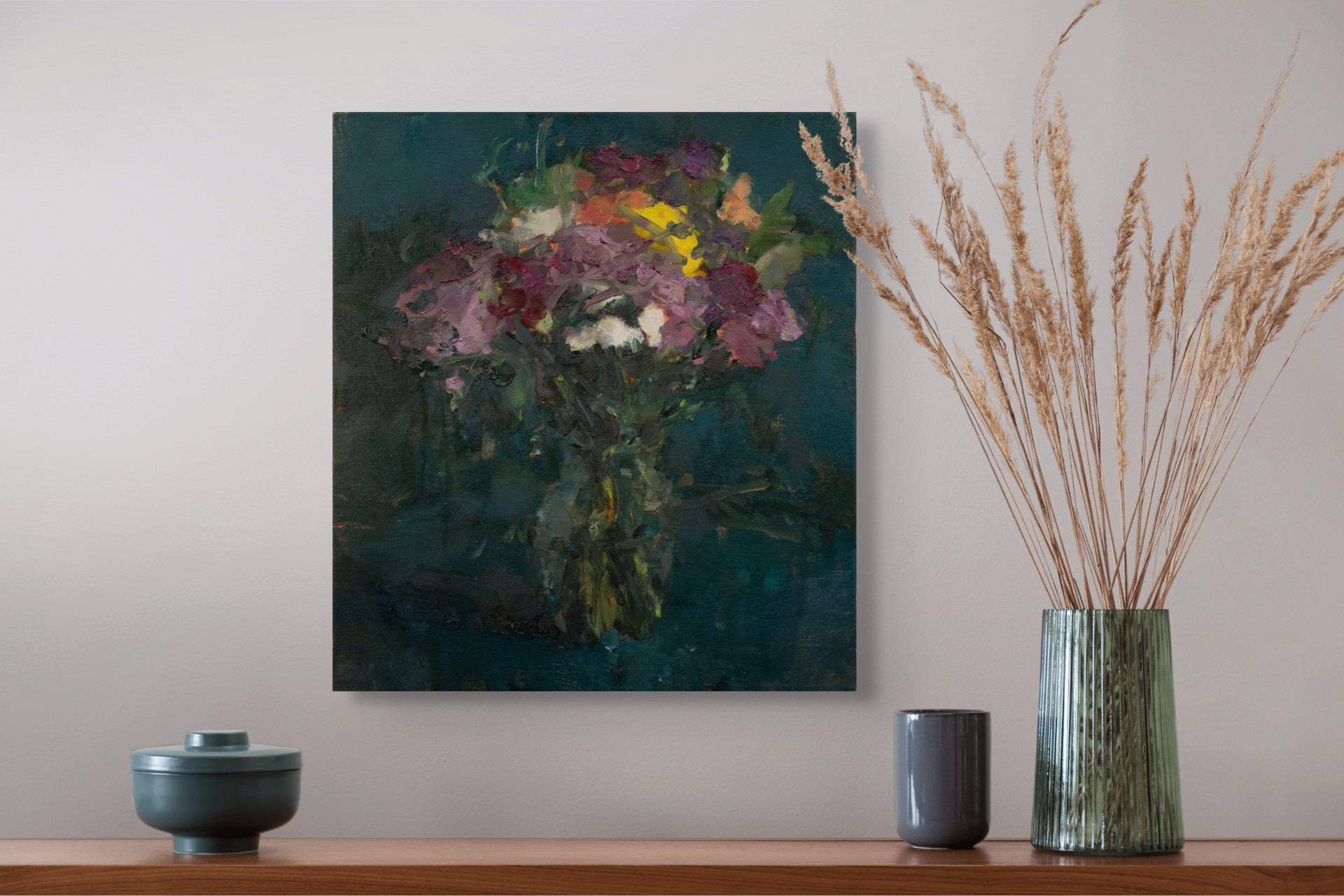 A vibrant bouquet of flowers in a vase against a dark teal background.