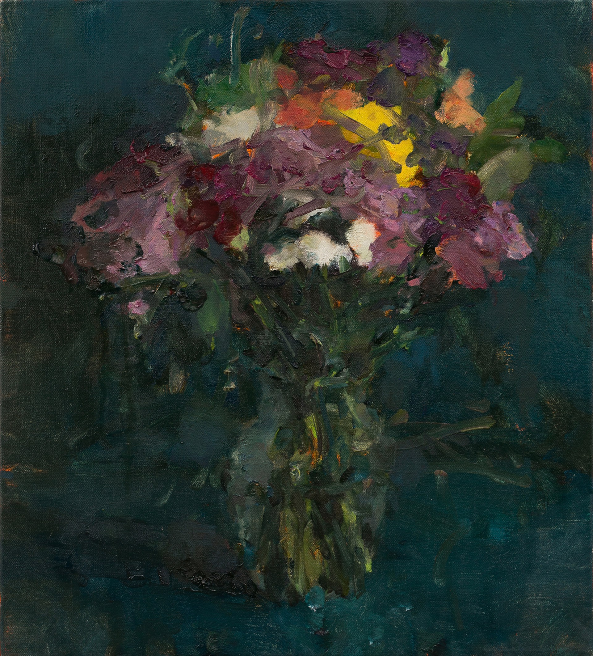 A vibrant bouquet of flowers in a vase against a dark teal background.