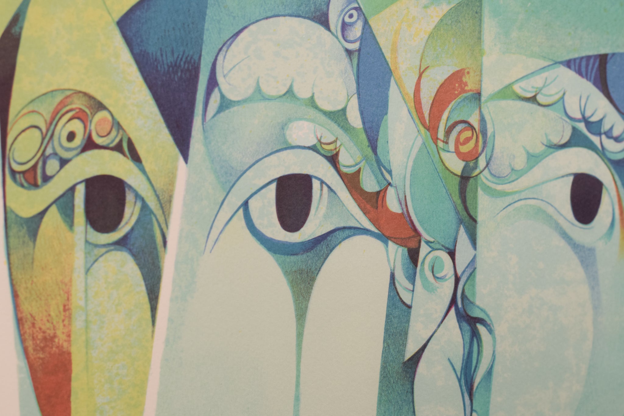 A painting of three faces of a man and a woman.