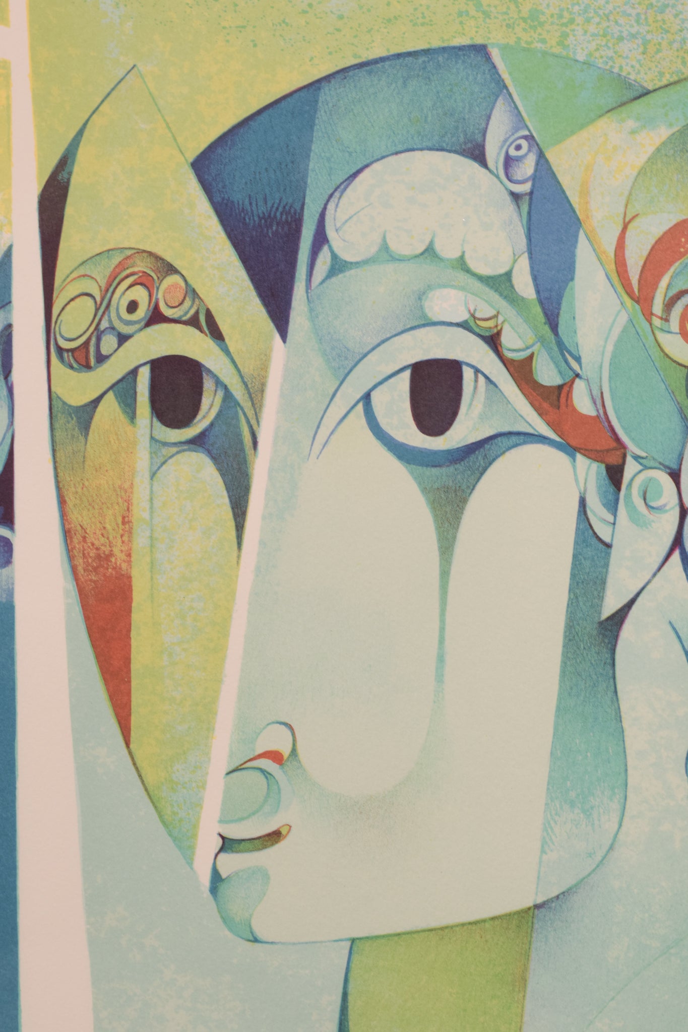 A painting of three faces of a man and a woman.