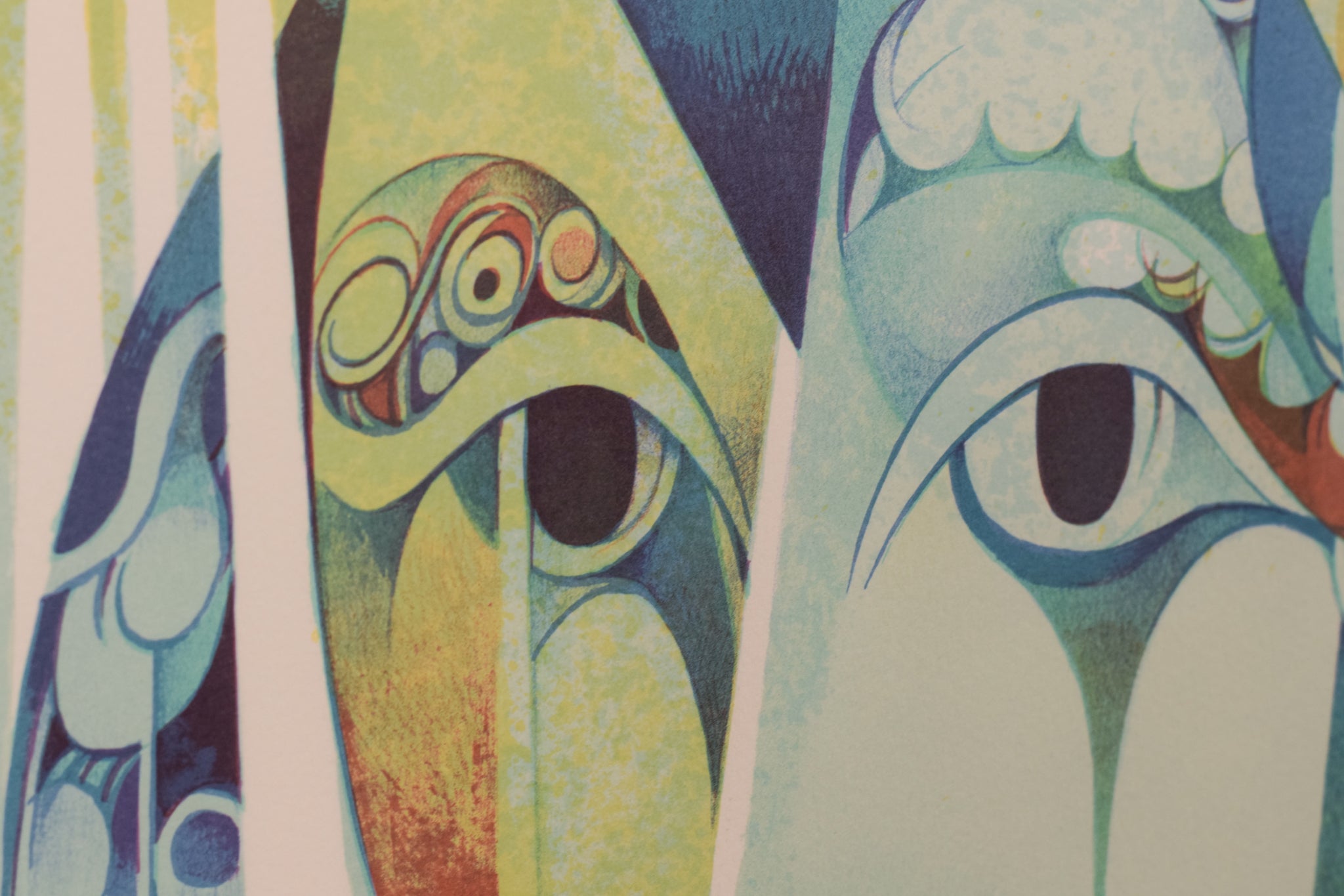 A painting of three faces of a man and a woman.